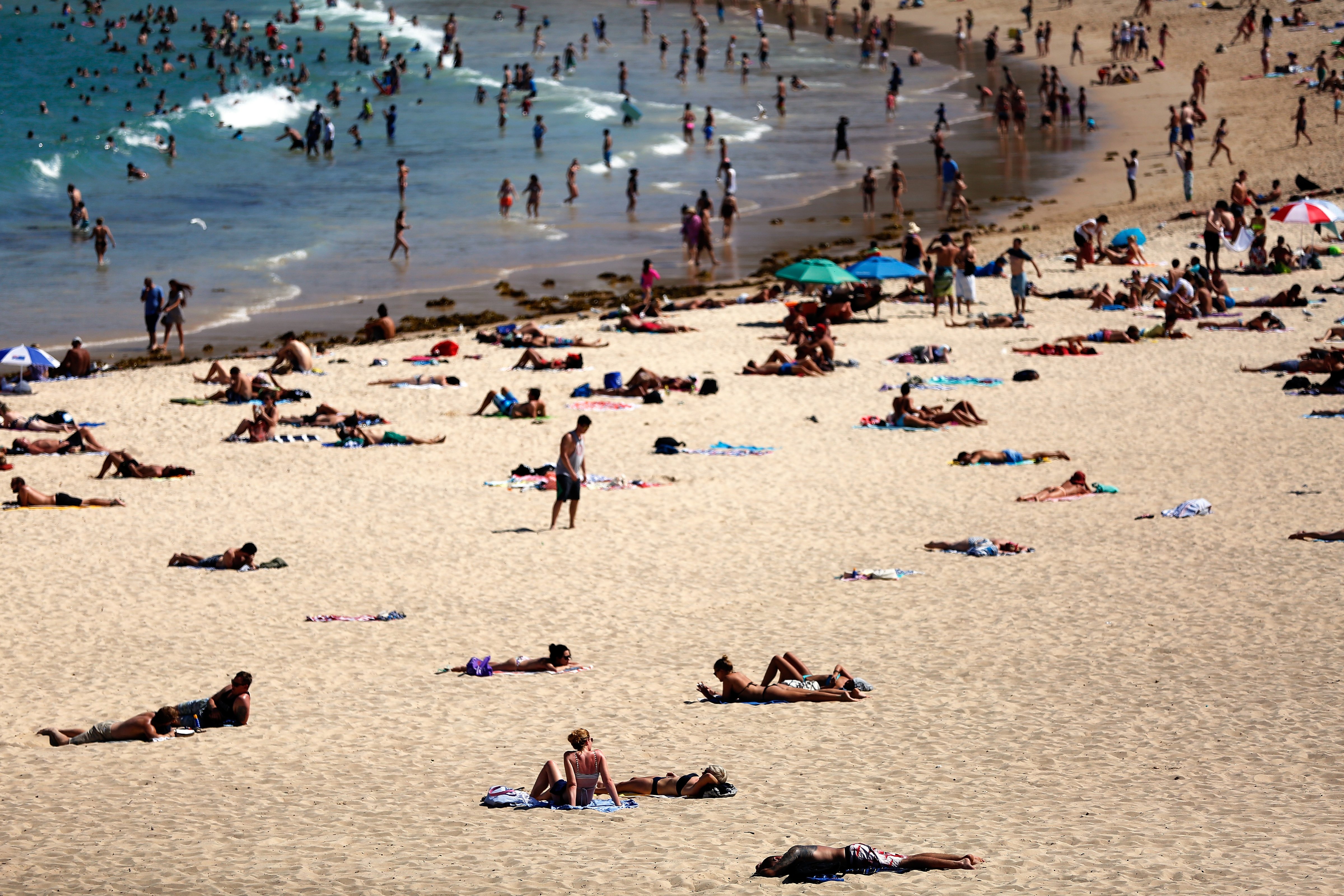Beachgoers enjoy the hot weather at Coogee Beach on Jan. 13, 2016 in Sydney.