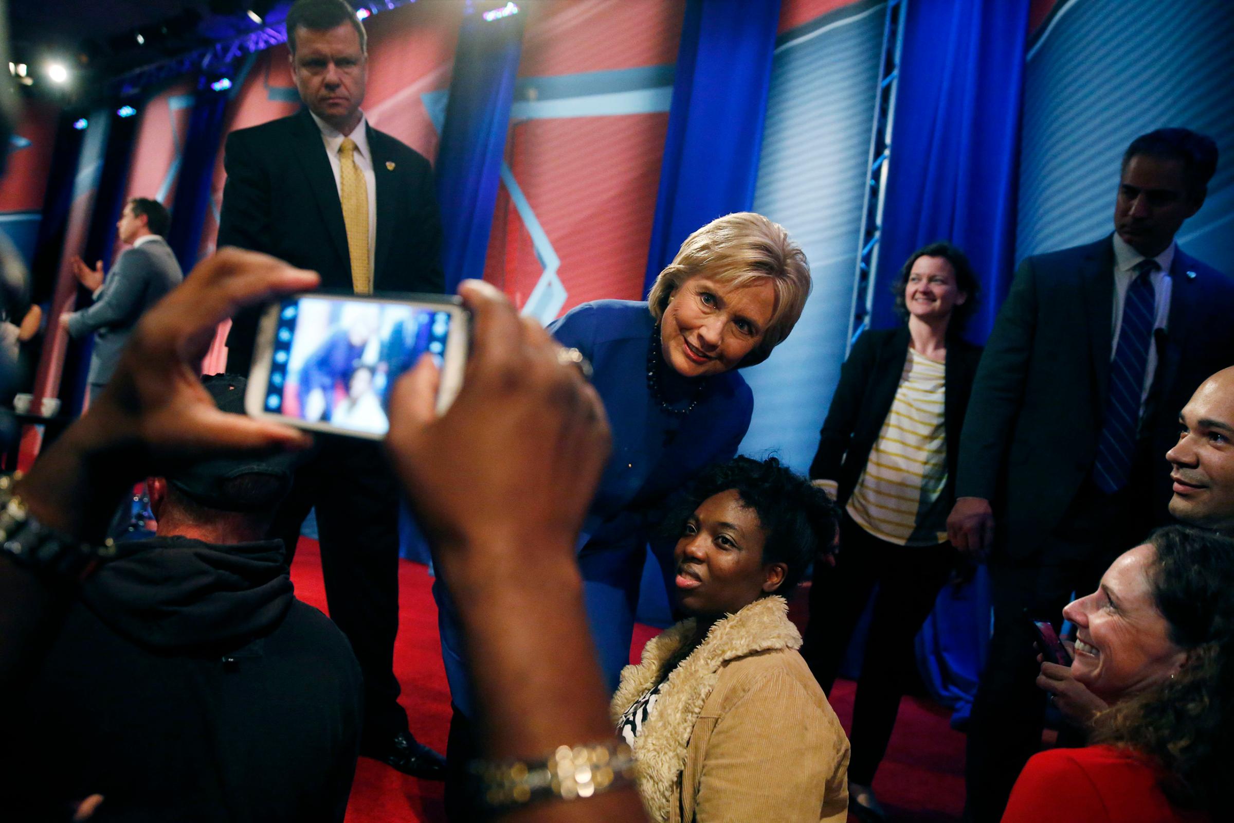 Democratic presidential candidate Hillary Clinton poses for photos with audience members after participating in a CNN town hall event at the University of South Carolina School of Law in Columbia, Feb. 23, 2016.