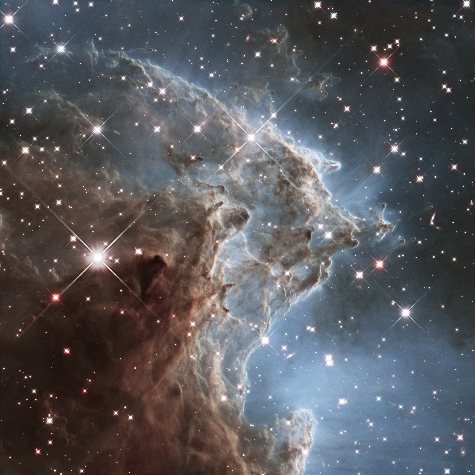 A view of the Monkey Head Nebula, released on March 17, 2014.  Otherwise known as NGC 2174, the nebula is a cloud of gas and dust that lies about 6400 light-years away in the constellation of Orion. Nebulas like this one are popular targets for Hubble, their colourful plumes of gas and fiery bright stars create ethereally beautiful pictures. (NASA/ESA/Hubble Heritage Team)