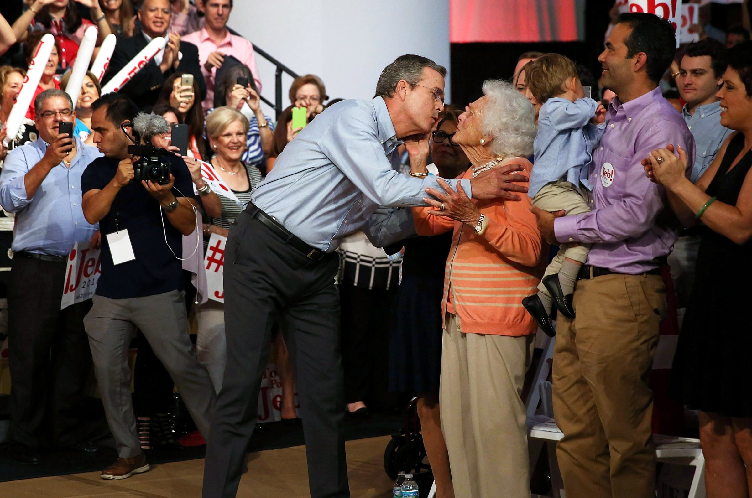 Former Florida Gov. Jeb Bush kisses his mother Barbara Bush on June 15 , 2015 in Miami.