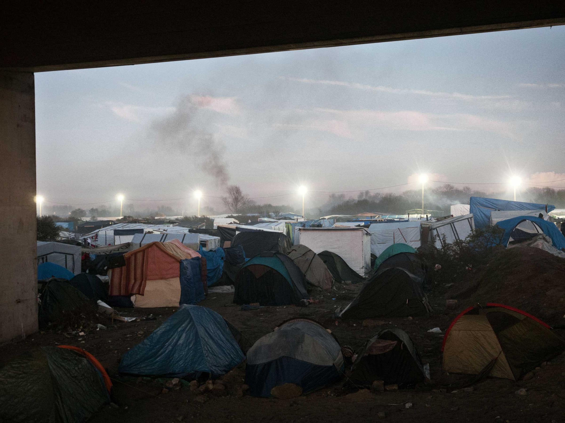 The tents that make the shantytown known as the ÒjungleÓ of Calais, France, where a mix of refugees, asylum seekers and economic migrants from Darfur, Afghanistan, Syria, Iraq, Eritrea live before they attempt to enter the United Kingdom by stowing away on ferries, cars, or trains traveling through the Port of Calais or the Eurotunnel, Nov. 26, 2015.