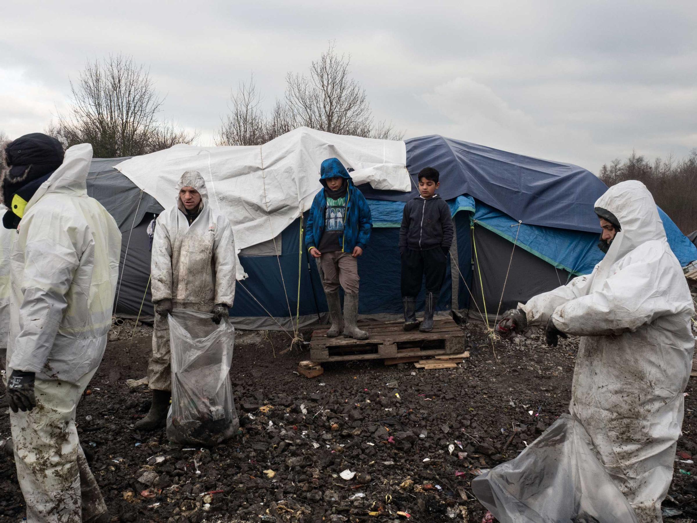 A group of workers from a private company have been hired to clean the trash left by the migrants in Grande-Synthe, the refugee camp near Dunkirk, which is accommodating over 2,500 refugees mostly families from Kurdistan, Jan.20, 2016.