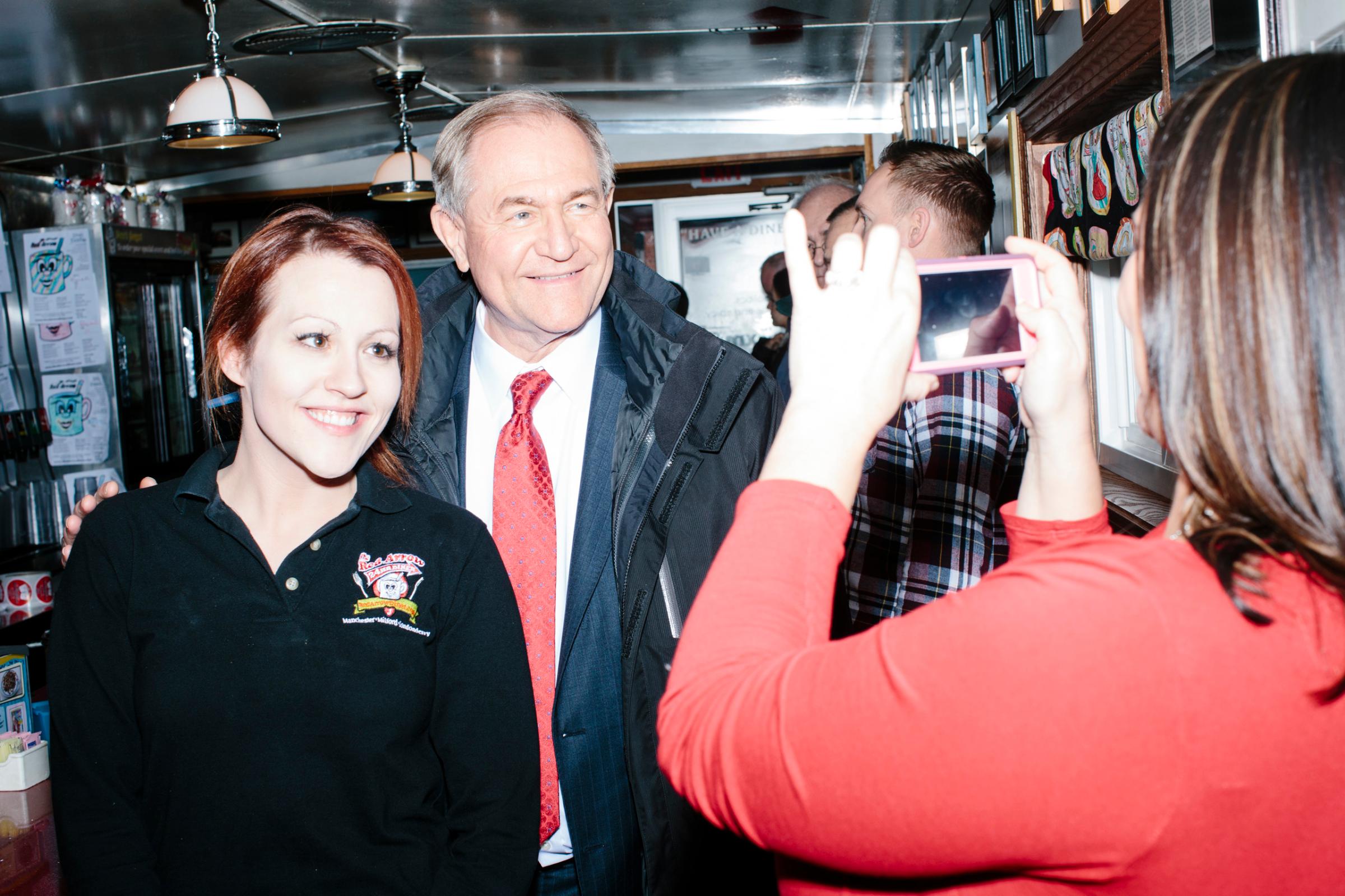 Former Virginia governor and Republican presidential candidate Jim Gilmore poses for a picture with general manager Jayme Lemay, of Nashua, NH, at the Red Arrow Diner in Manchester, New Hampshire, on Mon., Feb. 8, 2016. The Red Arrow Diner is a frequent stop of political candidates. Sirius XM was broadcasting live from the diner Monday and Tuesday. Gilmore finished in last place among major Republican candidates still in the race with a total of 150 votes.