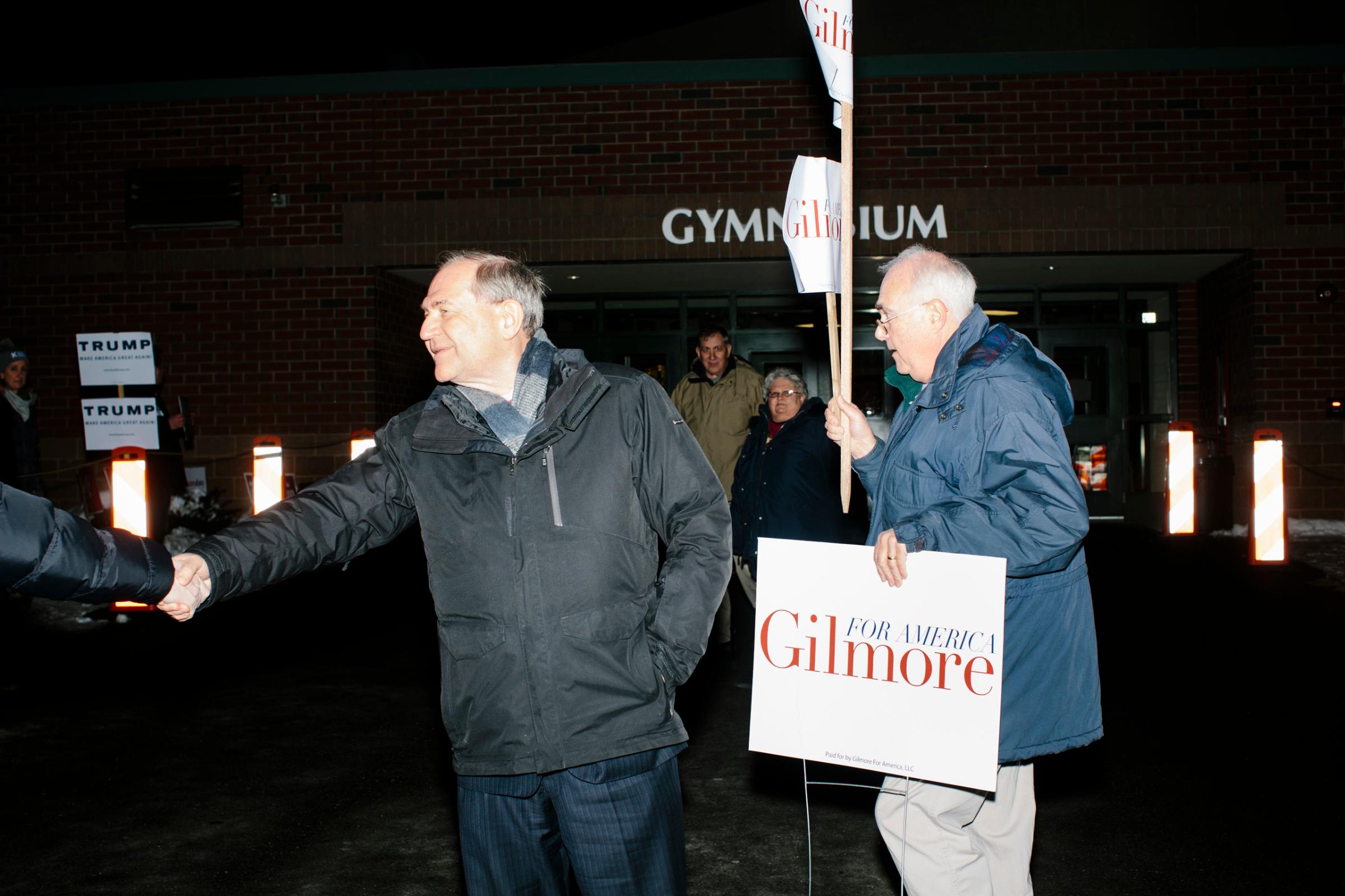Former Virginia governor and Republican presidential candidate Jim Gilmore greets people outside the polling station at Bedford High School in Bedford New Hampshire, on the day of primary voting, Feb. 9, 2016. Gilmore finished in last place among major Republican candidates still in the race with a total of 150 votes.