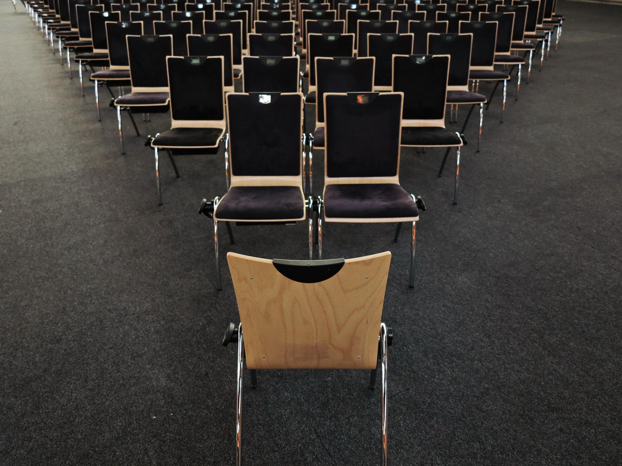 One chair facing an audience