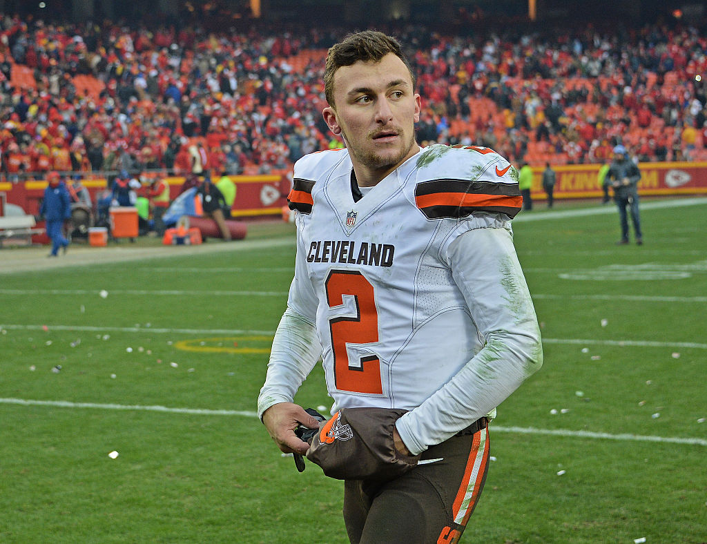 Quarterback Johnny Manziel of the Cleveland Browns walks off the field after losing to the Kansas City Chiefs on Dec. 27, 2015 at Arrowhead Stadium in Kansas City, Missouri.