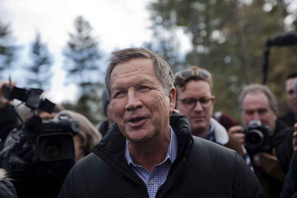 John Kasich, governor of Ohio and 2016 Republican presidential candidate, greets voters while arriving at a polling station at Broken Gound Elementary School in Concord, New Hampshire. (Bloomberg-Bloomberg via Getty Images)