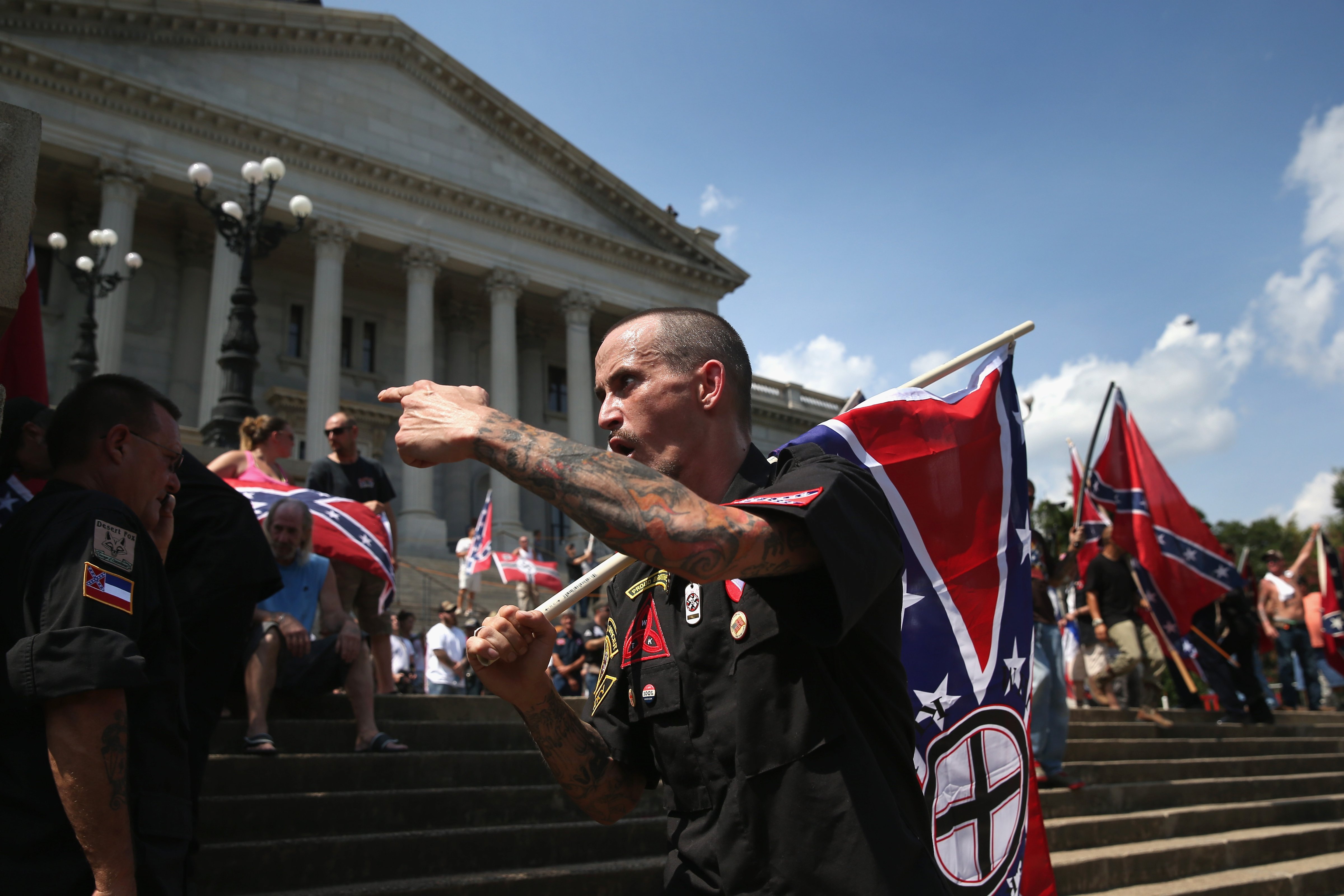 Counter protesters and Ku Klux Klan members argue at a Klan demonstration at the state house building  in Columbia, SC on July 18, 2015. (John Moore—Getty Images)