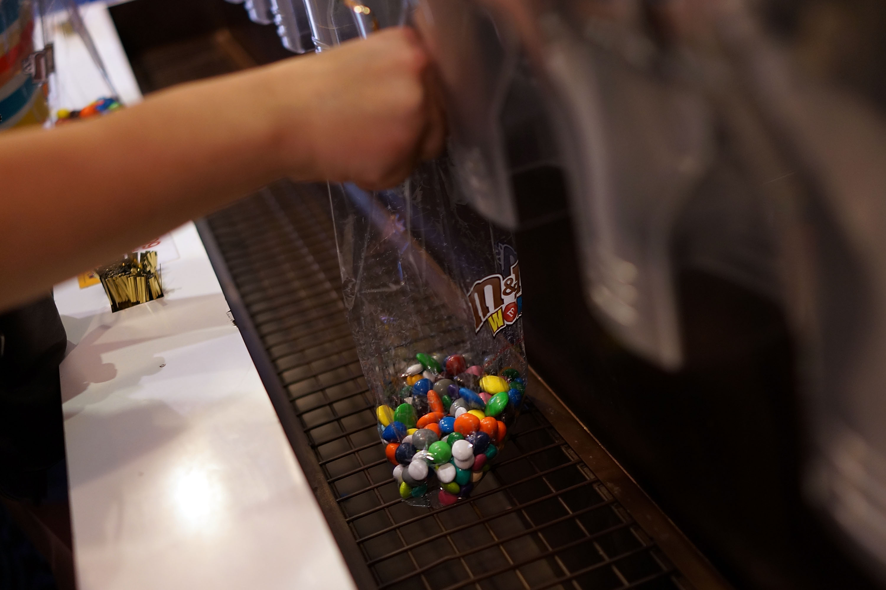 People fill up bags of M&amp;M's at the M&amp;M store in Times Square in New York City on July 24, 2014. (Spencer Platt—Getty Images)