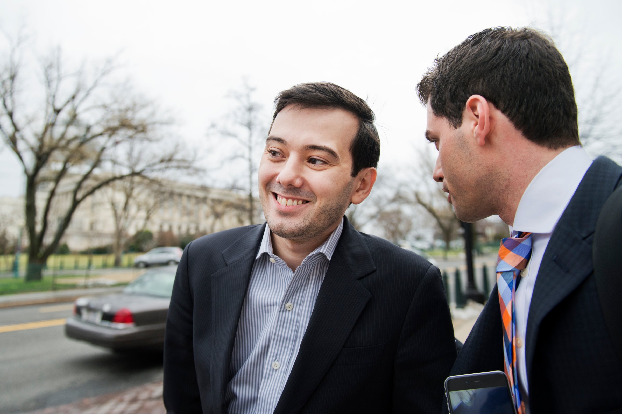 UNITED STATES - FEBRUARY 04: Martin Shkreli, center, former CEO Turing Pharmaceuticals, leaves a House Oversight and Government Reform Committee in Rayburn Building on "methods and reasoning behind recent drug price increases," after invoking his Fifth Amendment right against self-incrimination, February 04, 2016. Turing had raised the price of Daraprim, a drug used by AIDS and cancer patients, from $13.50 to $750 a pill. His attorney Benjamin Brafman appears second from right. (Photo By Tom Williams/CQ Roll Call)
