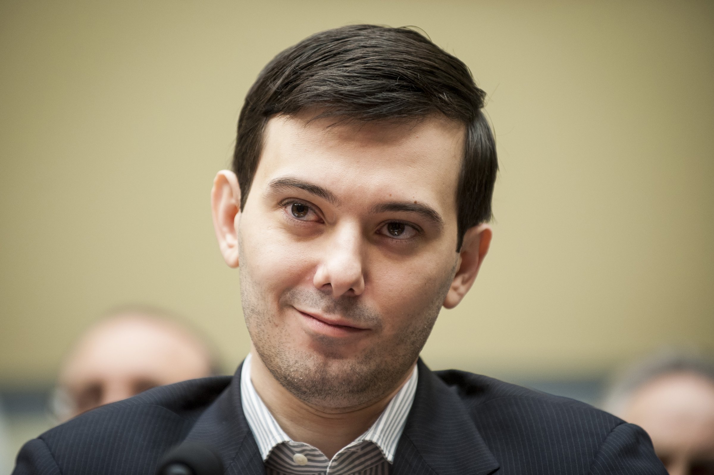 Martin Shkreli, former chief executive officer of Turing Pharmaceuticals LLC, smiles during a House Committee on Oversight and Government Reform hearing on prescription drug prices in Washington, D.C., U.S., on Thursday, Feb. 4, 2016.