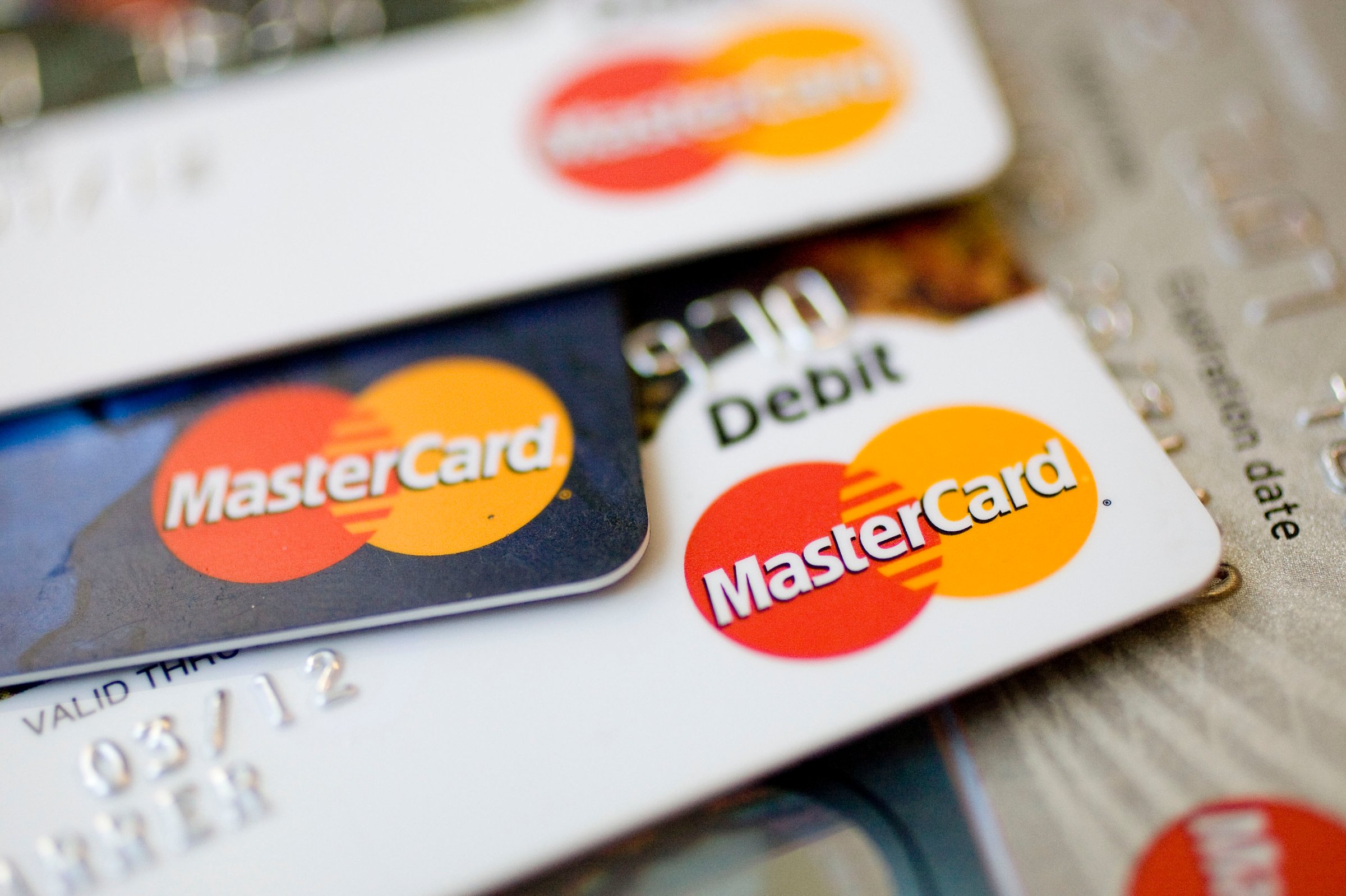 MasterCard logos appear on credit and debit cards arranged for a photograph in New York, U.S., on Thursday, July 30, 2009.