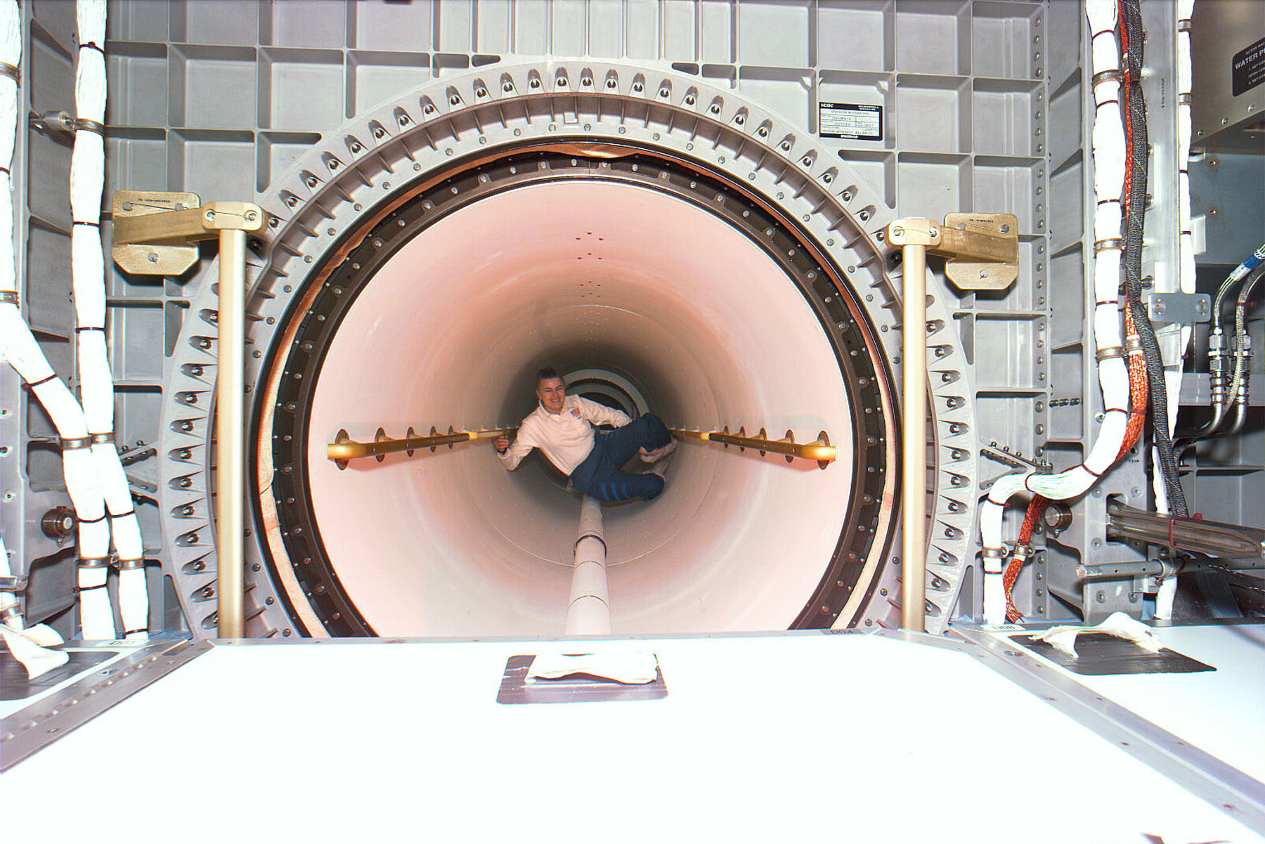 Astronaut Shannon W. Lucid floats through the tunnel that connects Spacehab to the Atlantis cabin inside the Mir space station, on Sept. 24, 1996.