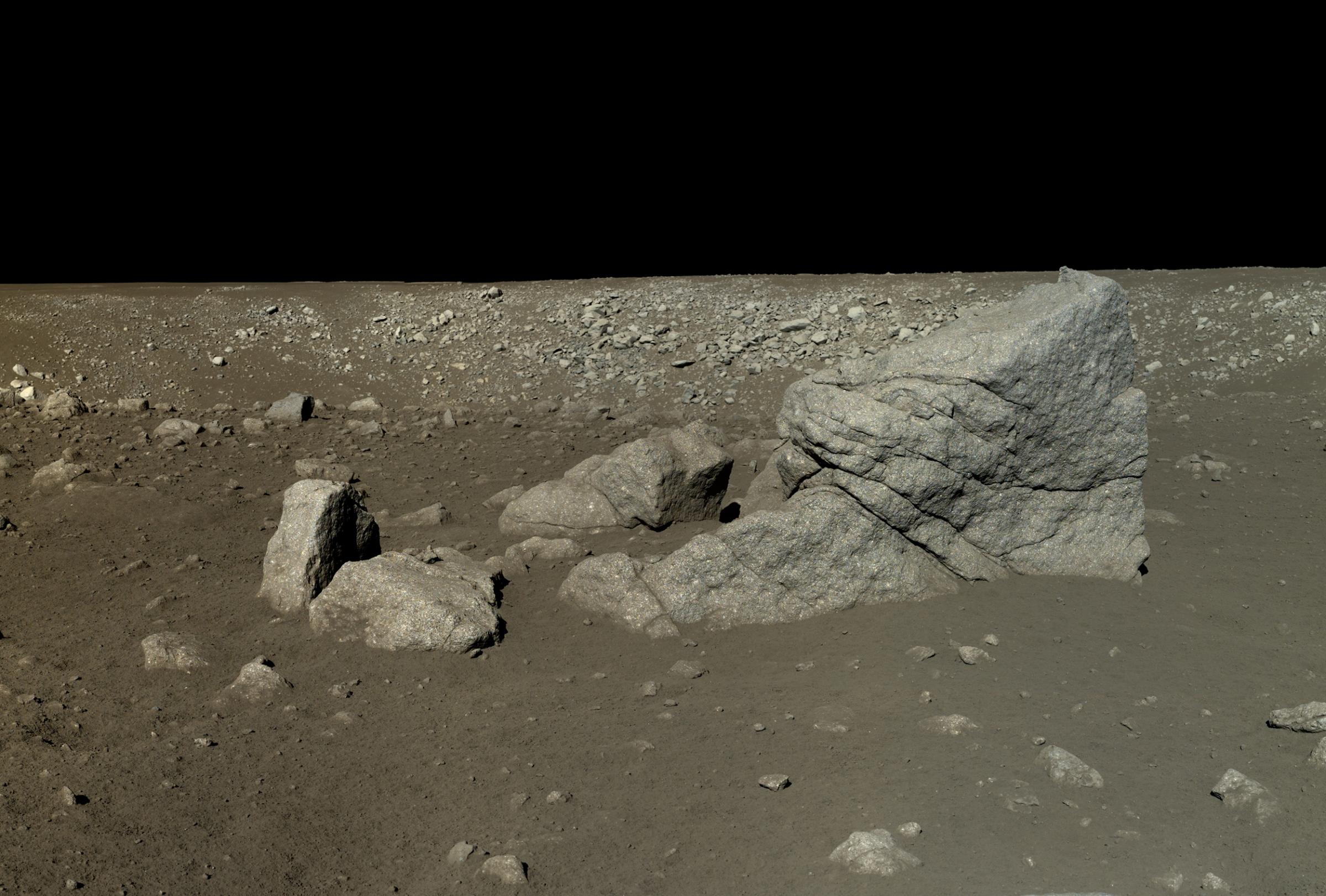 This is a mosaic of six images captured by the Yutu rover on Jan. 13, 2014, after it had driven southwest of the lander to visit a large block of impact ejecta that the team named Long Yan (Pyramid Rock).