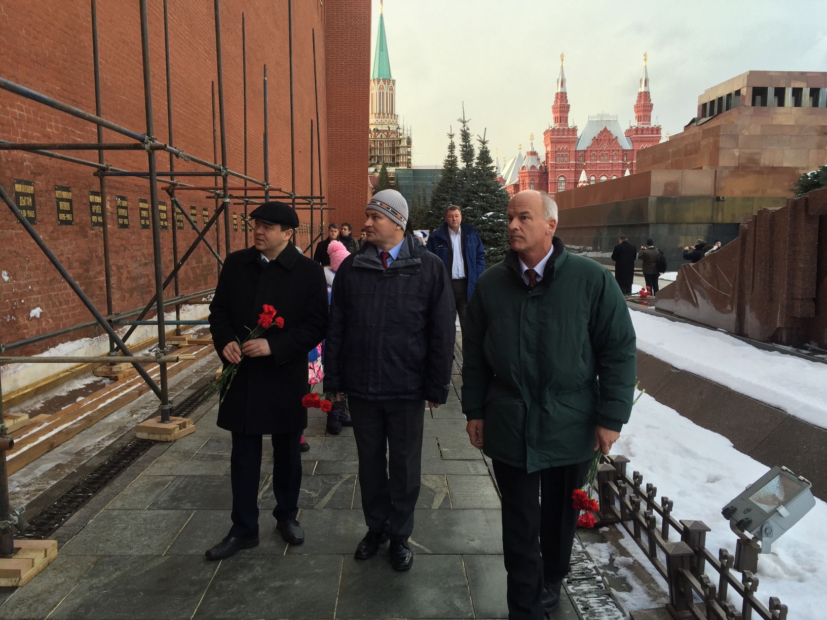 NASA astronaut Jeff Williams, right, along with Russian Cosmonauts Oleg Skripochka, left, and Alexey Ovchnin prepare for a ceremonial laying of flowers at the graves of Yuri Gagarin and Sergey Korolev outside the Kremlin near Red Square in Moscow on Friday, Feb. 26, 2016. (Jonathan D. Woods/TIME)