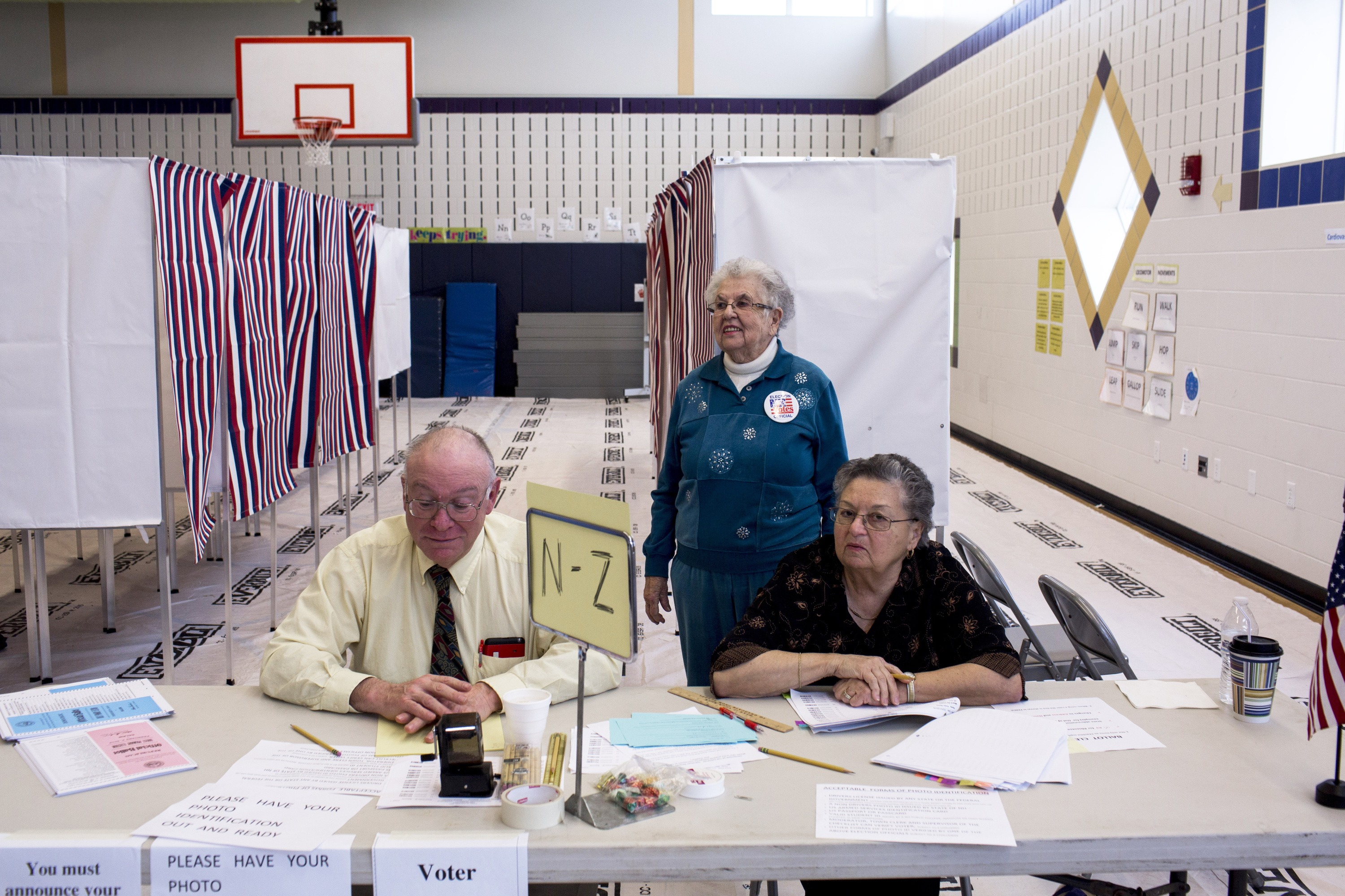 Volunteers staff a polling station at Windham High School on Feb. 9, 2016, in Windham, N.H. (Natalie Keyssar for TIME)
