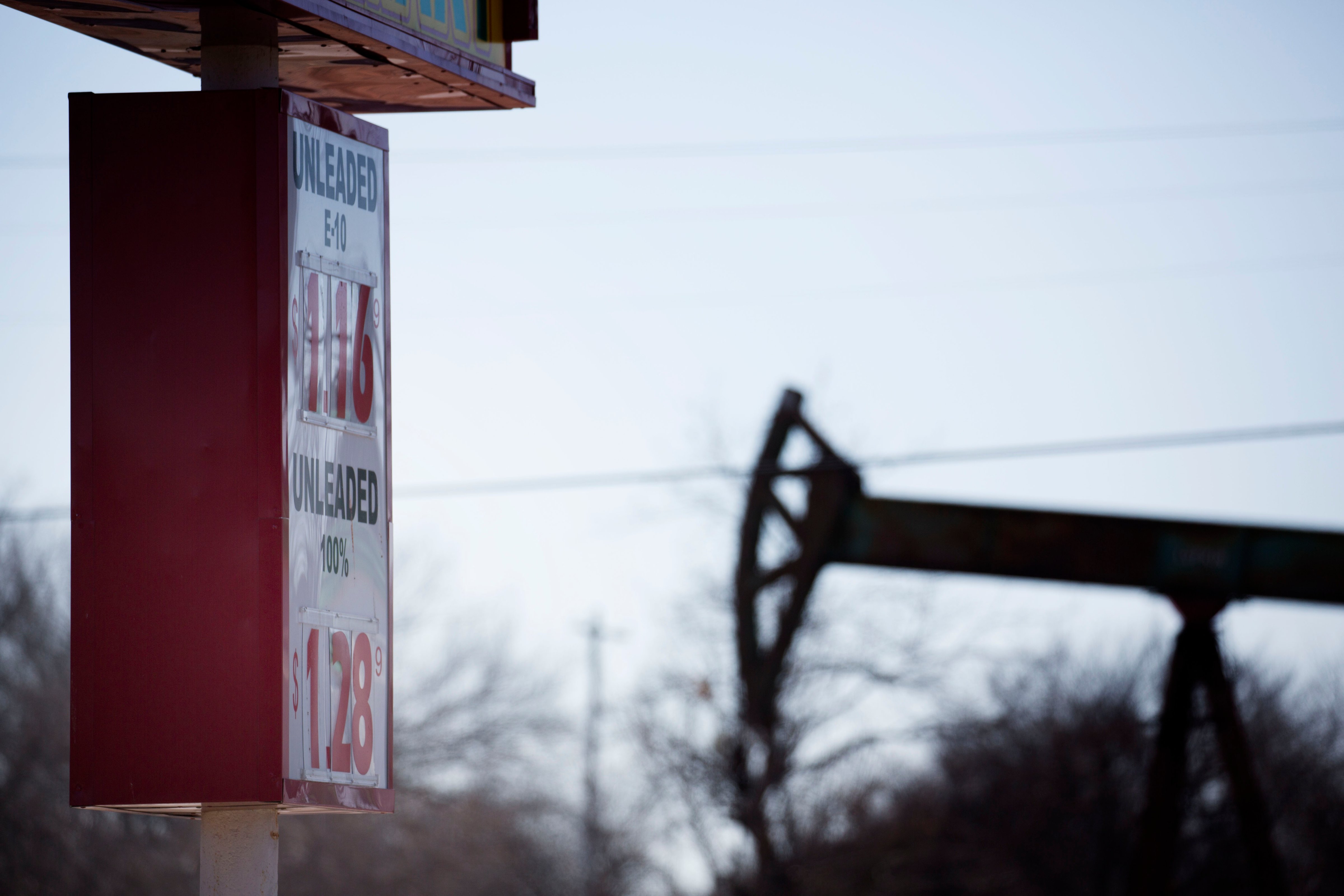 A gas station, near an oil well pumper, was selling gas for $1.16 a gallon February 12, 2016 in Oklahoma City, Oklahoma. (J Pat Carter/Getty Images)