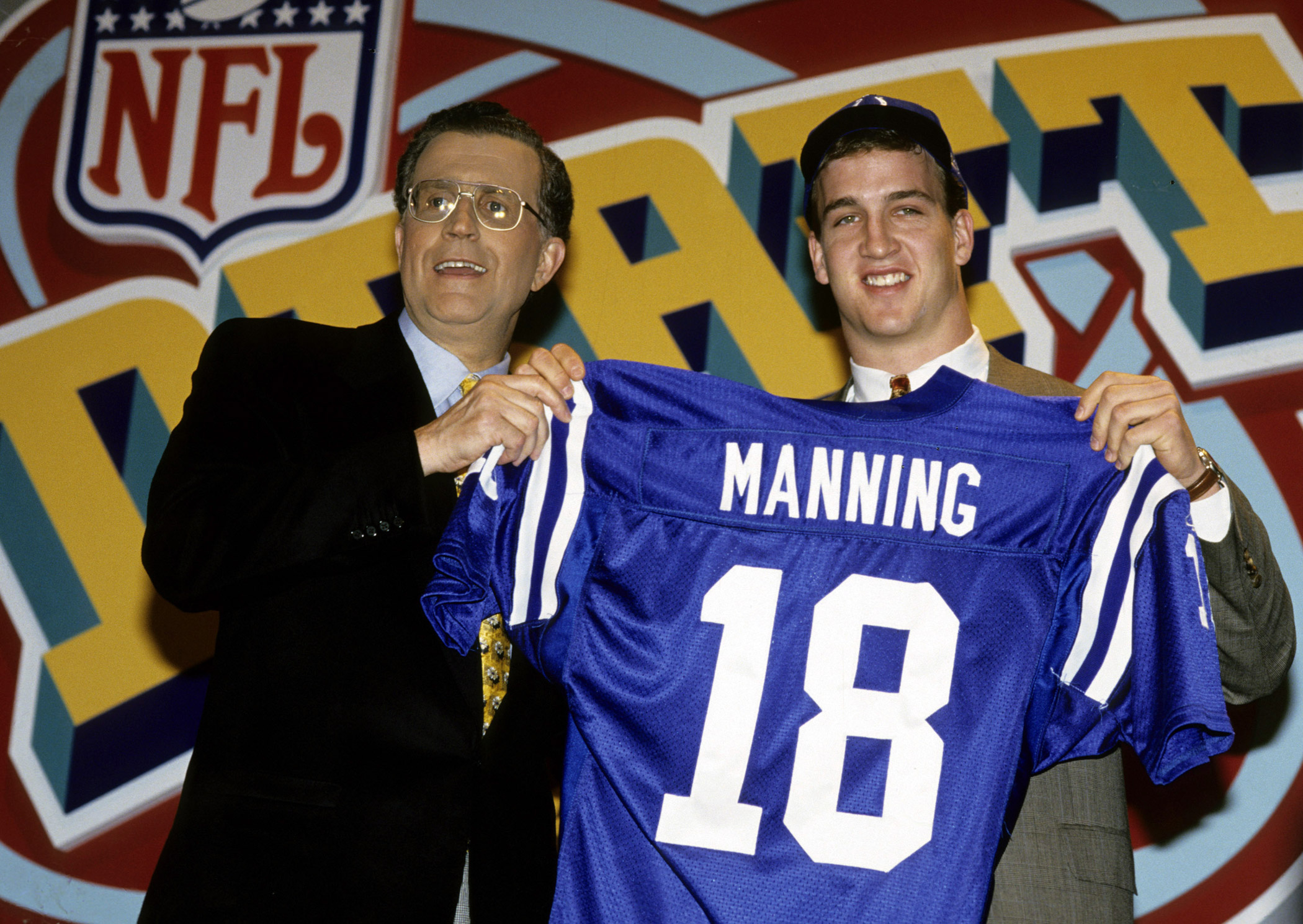 Peyton Manning was selected as the first overall draft pick by the Indianapolis Colts on April 18, 1998. He is introduced by NFL Commissioner Paul Tagliabue at the 1998 NFL Draft in New York.