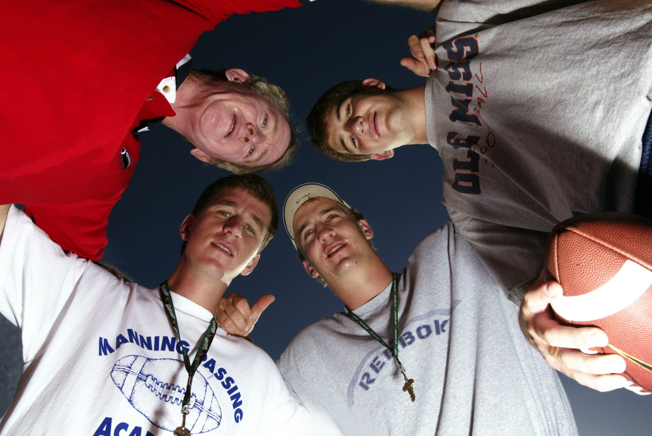 The Mannings pose for a portrait at the Manning Passing Academy in 2003. Clockwise from top left are Archie, Eli, Peyton and Cooper.