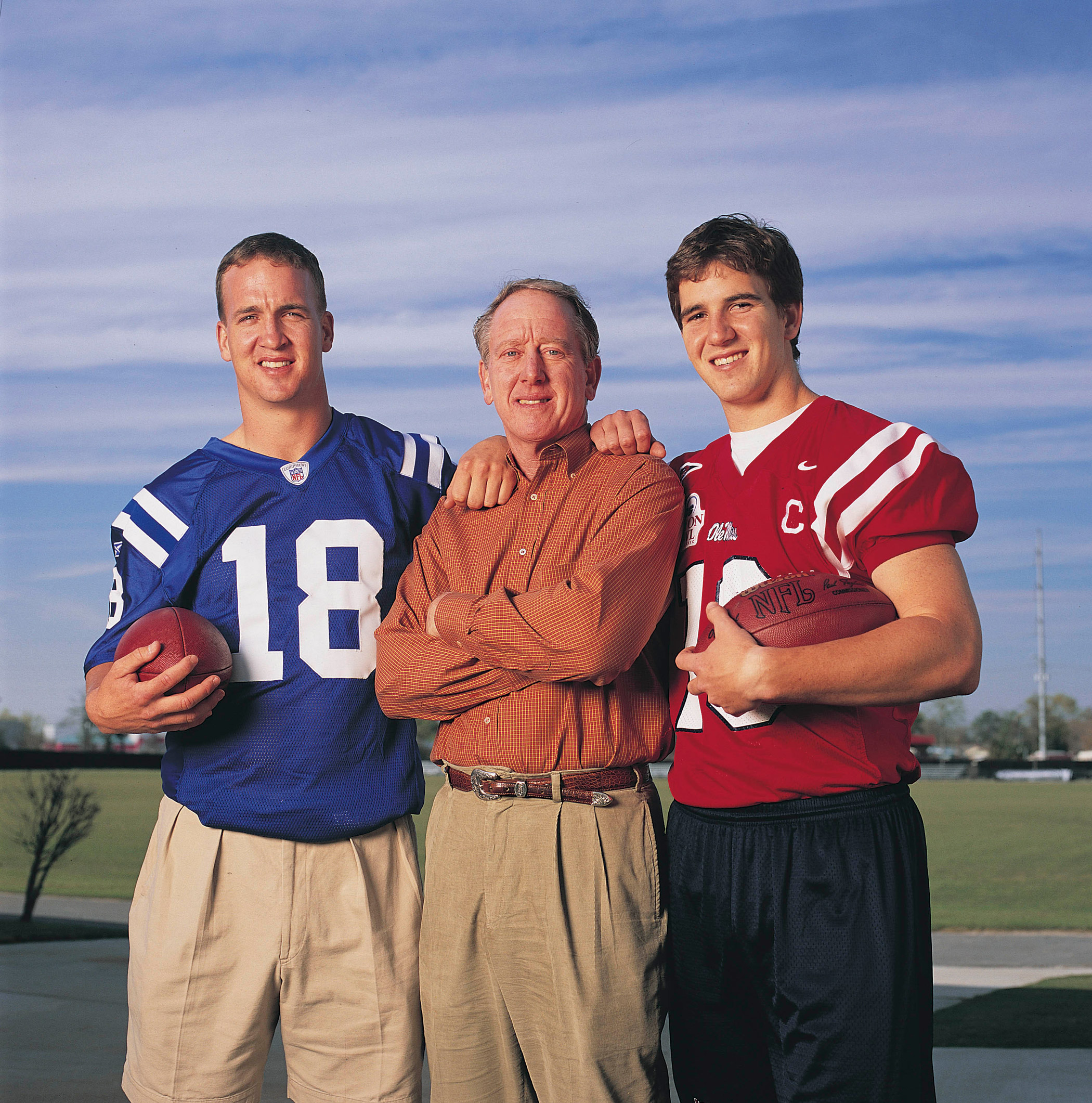 The Mannings pose for a portrait in 2004. From left are Indianapolis Colts quarterback Peyton Manning, former New Orleans Saints quarterback Archie Manning and New York Giants quarterback Eli Manning.