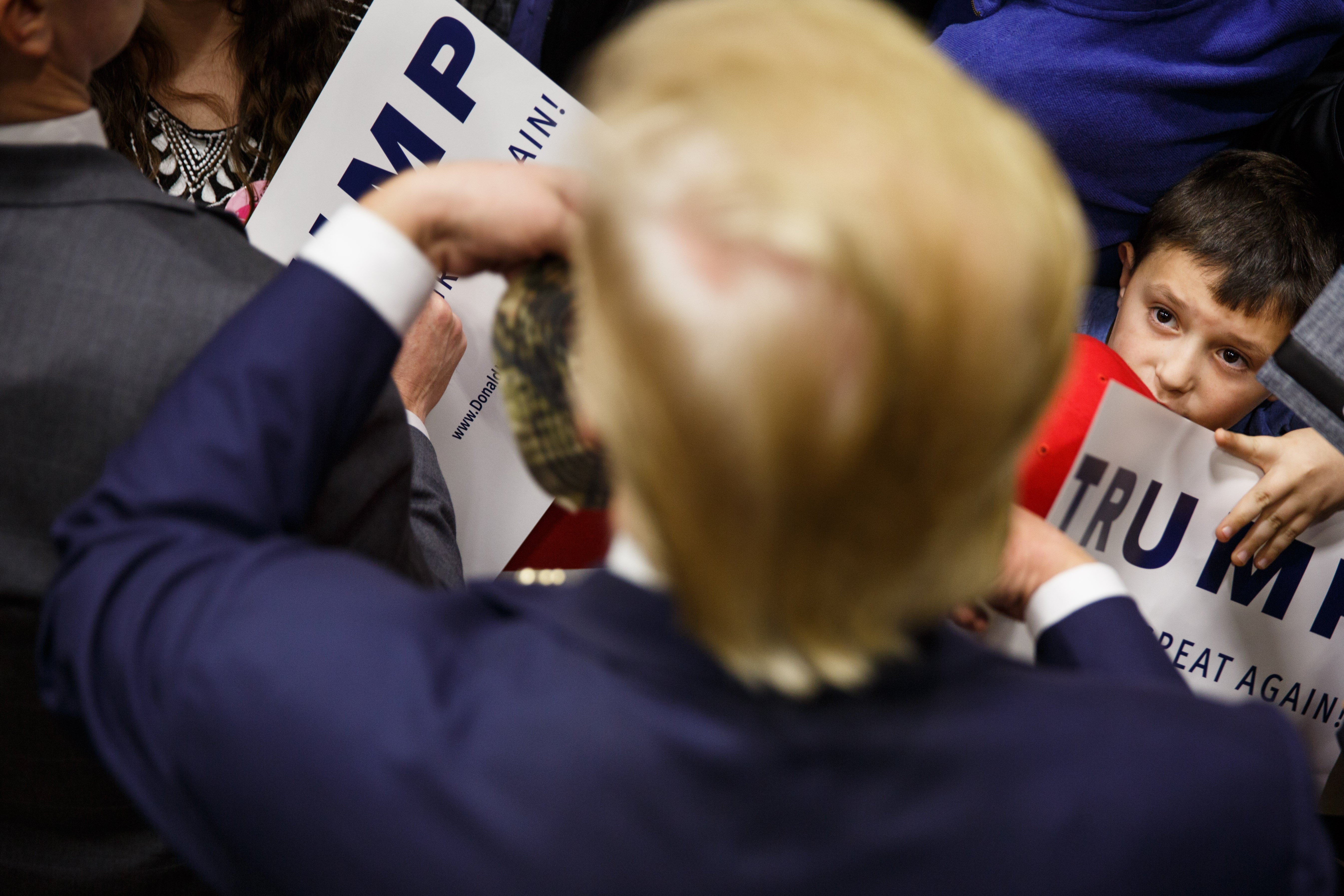 Republican presidential candidate Donald Trump greets attendees after speaking at the Great Bay Community College in Portsmouth, N.H., Feb. 4, 2016.