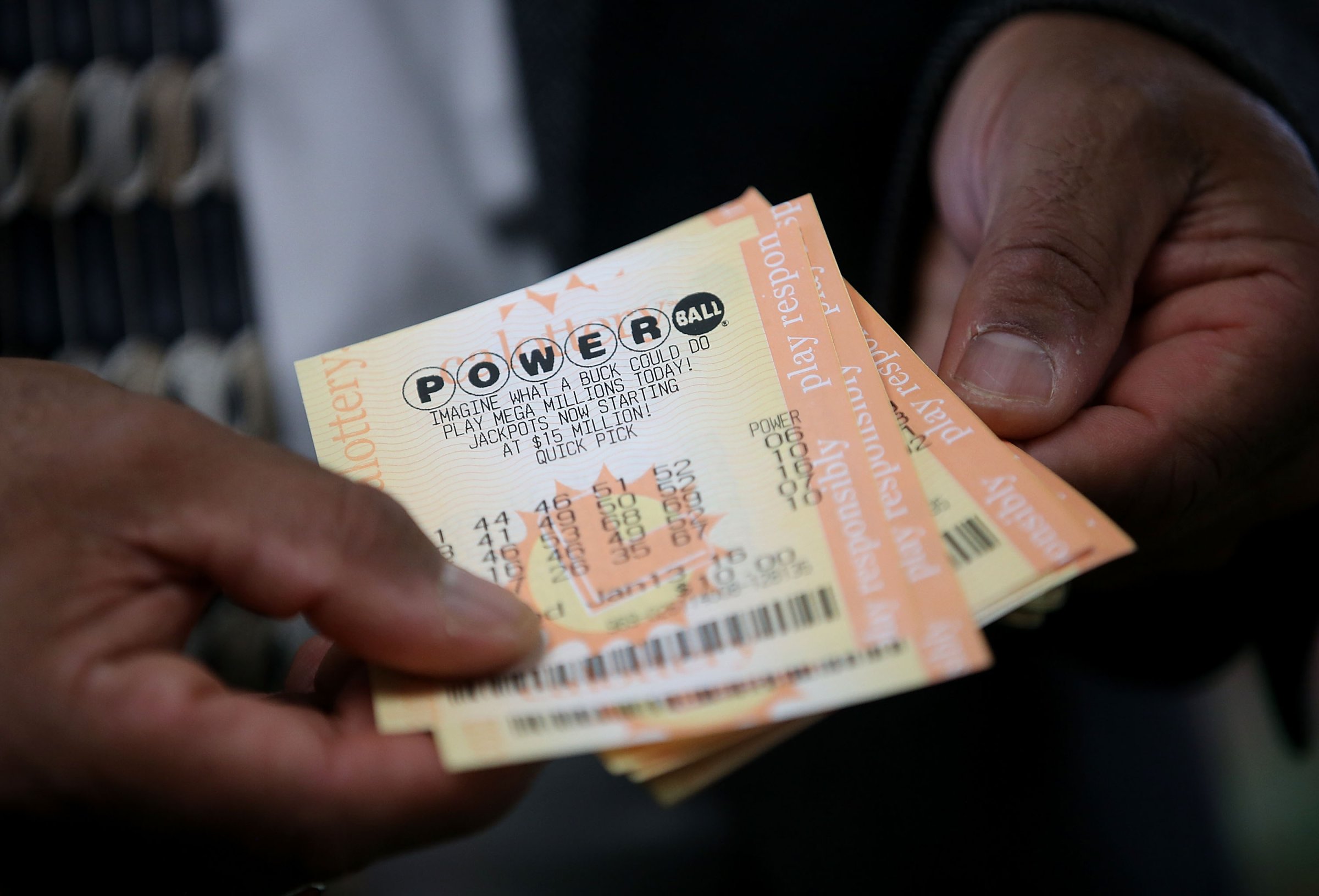 A customer holds Powerball tickets that he purchased at Kavanagh Liquors on January 12, 2015 in San Lorenzo, California.
