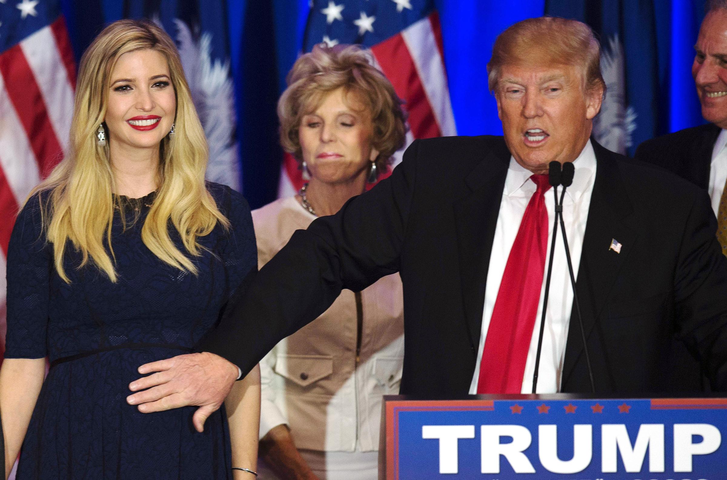 Republican presidential candidate Donald Trump pats the stomach of daughter Ivanka Trump, who is expecting a baby, in Spartanburg, S.C.