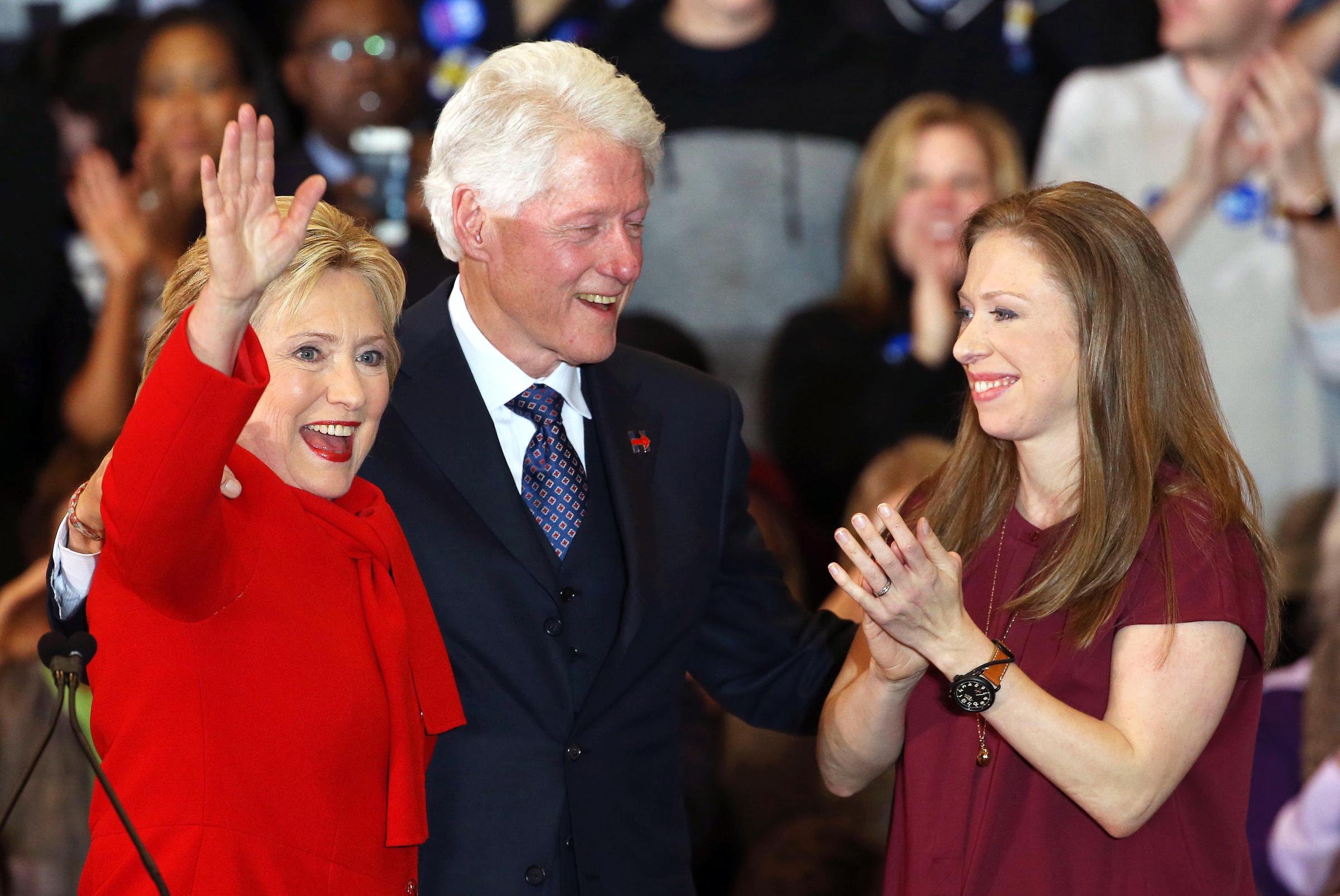 Democratic presidential candidate, former Secretary of State Hillary Clinton waves to supporters as husband and former President Bill Clinton and daughter Chelsea Clinton cheer at her caucus night event on Feb. 1, 2016 in Des Moines, Iowa.