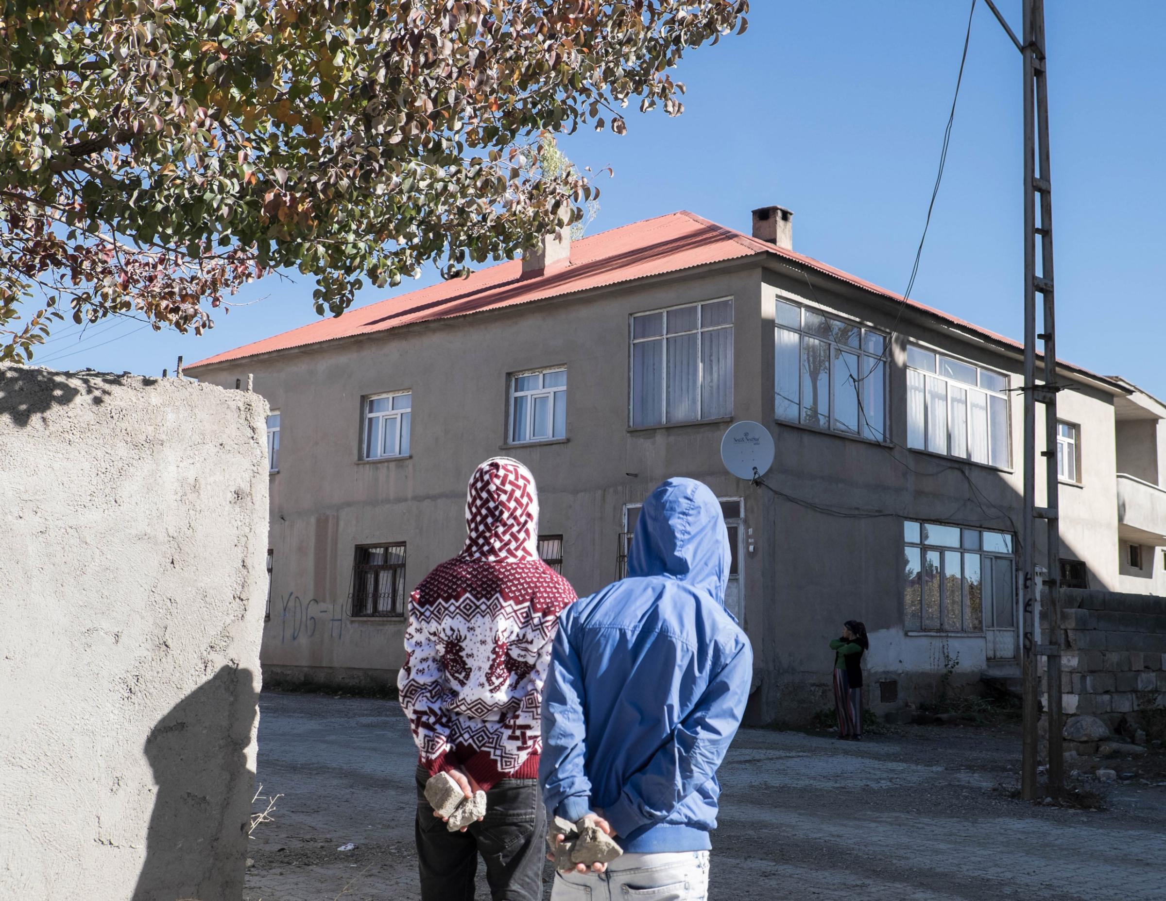 YUKSEKOVA, TURKEY - NOVEMBER 03, 2015: Young Kurds are seen during clashes against Turkish police forces in Cumhuriyet, a self declared autonomous neighborhood in Yuksekova. Clashes broke out after that police tried to enter into the neighborhood in early morning.