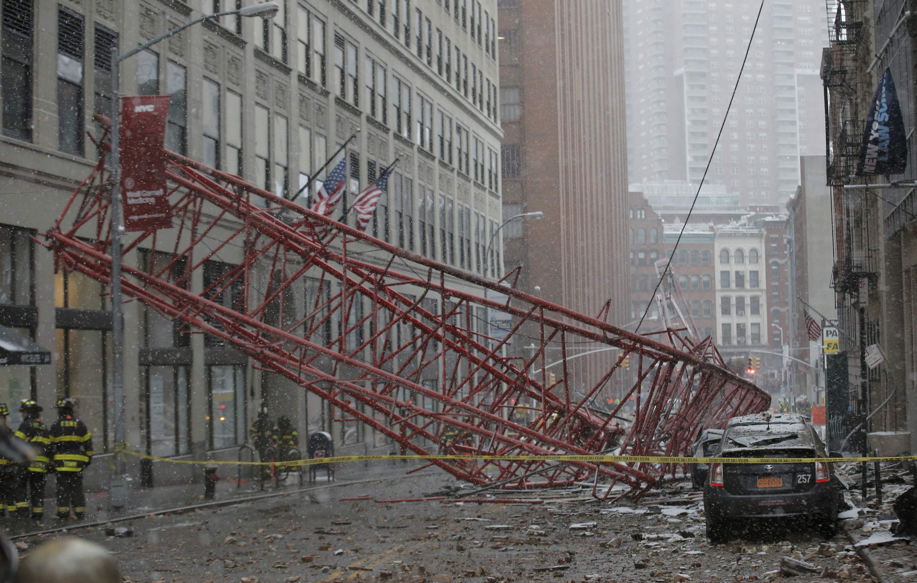 Emergency crews survey a massive construction crane collapse on a street in downtown Manhattan in New York City, on Feb. 5, 2016. (Brendan McDermid—Reuters)