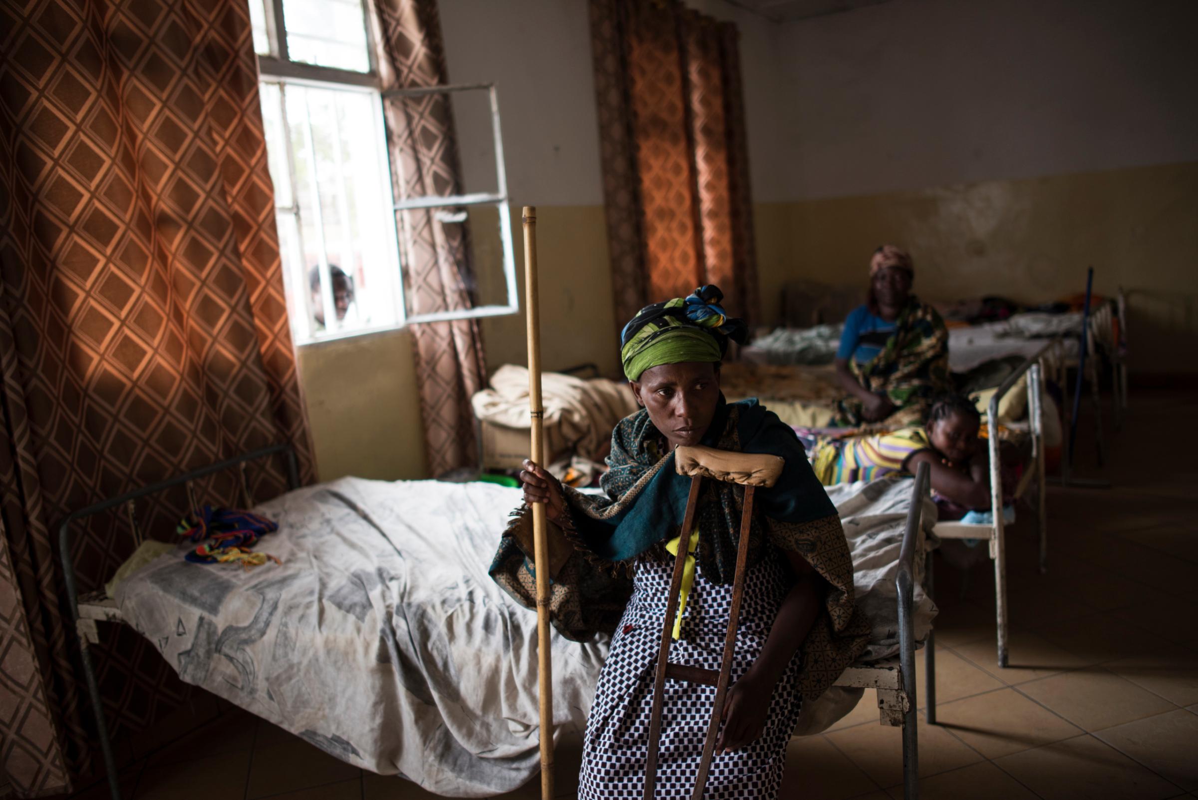 Ferediana Kimanimbaye sits with crutches after recently re-breaking her leg and returning to the Heal Africa Hospital in Goma, the Democratic Republic of Congo, Dec. 5, 2015. Ferediana was gang-raped by soldiers of the Democratic Forces for the Liberation of Rwanda (FDLR), a Hutu rebel group in eastern DRC, when they attacked her village more than 7 years ago. They killed her husband, and three different men raped her. She fell and broke her leg while she was escaping. The U.N. reports that 200,000 Congolese women and children have been raped during Congo’s long-simmering conflict.