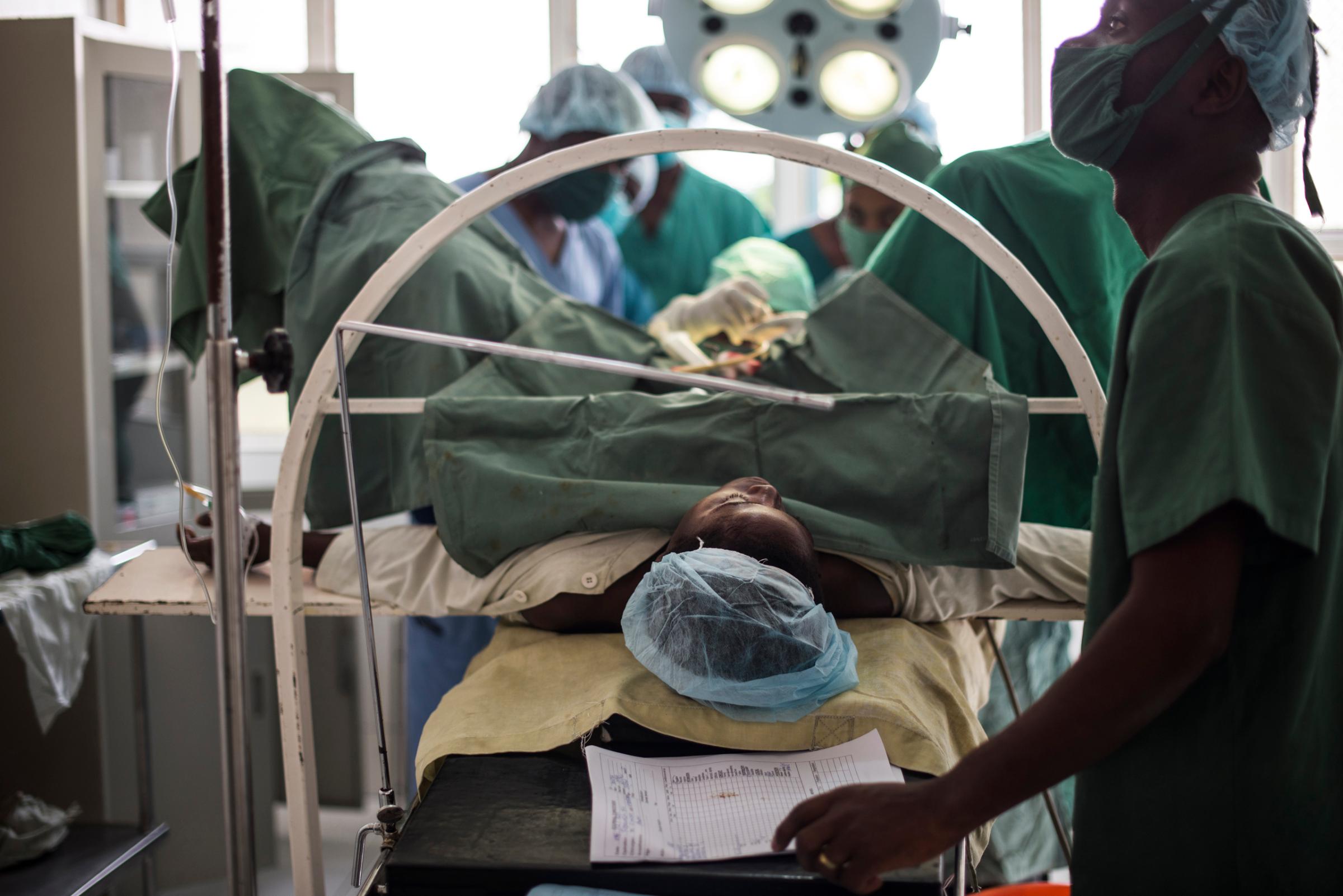 A woman receives fistula repair surgery in the Keyshero hospital in Goma, Democratic Republic of Congo, Dec. 5, 2015. Many women need fistula repair after rape. it is one of the biggest injuries post sexual assault. Women with fistulas from rape cannot retain their urine or feces.