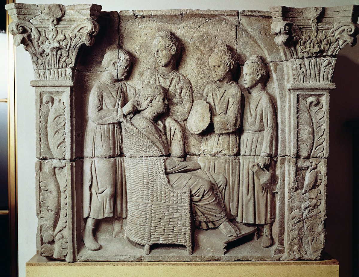2nd century A.D. Roman relief portraying a lady having her hair styled. (DEA / A. DAGLI ORTI / De Agostini / Getty Images)