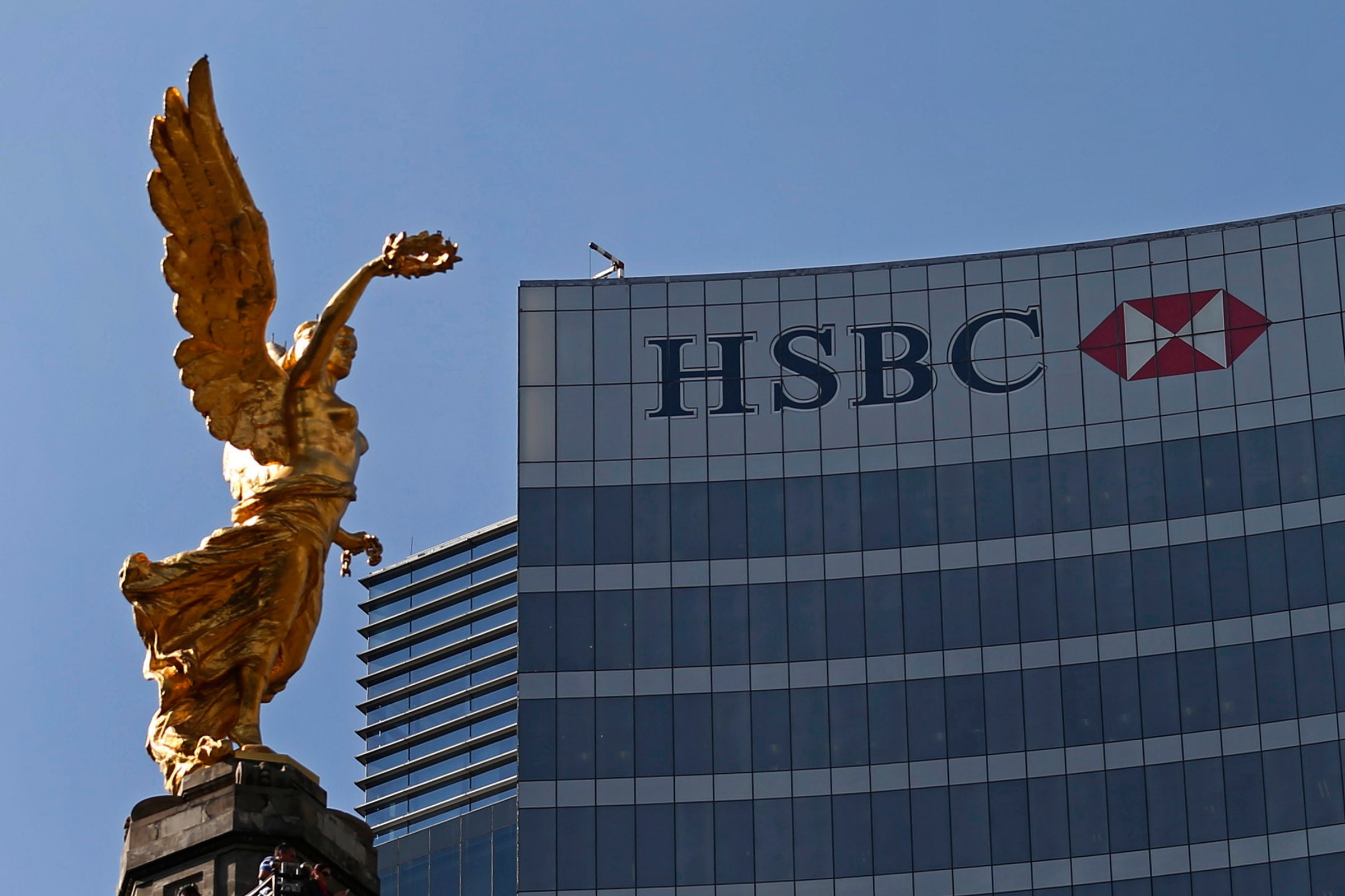 The Angel of Independence monument is seen near a building of HSBC in Mexico City
