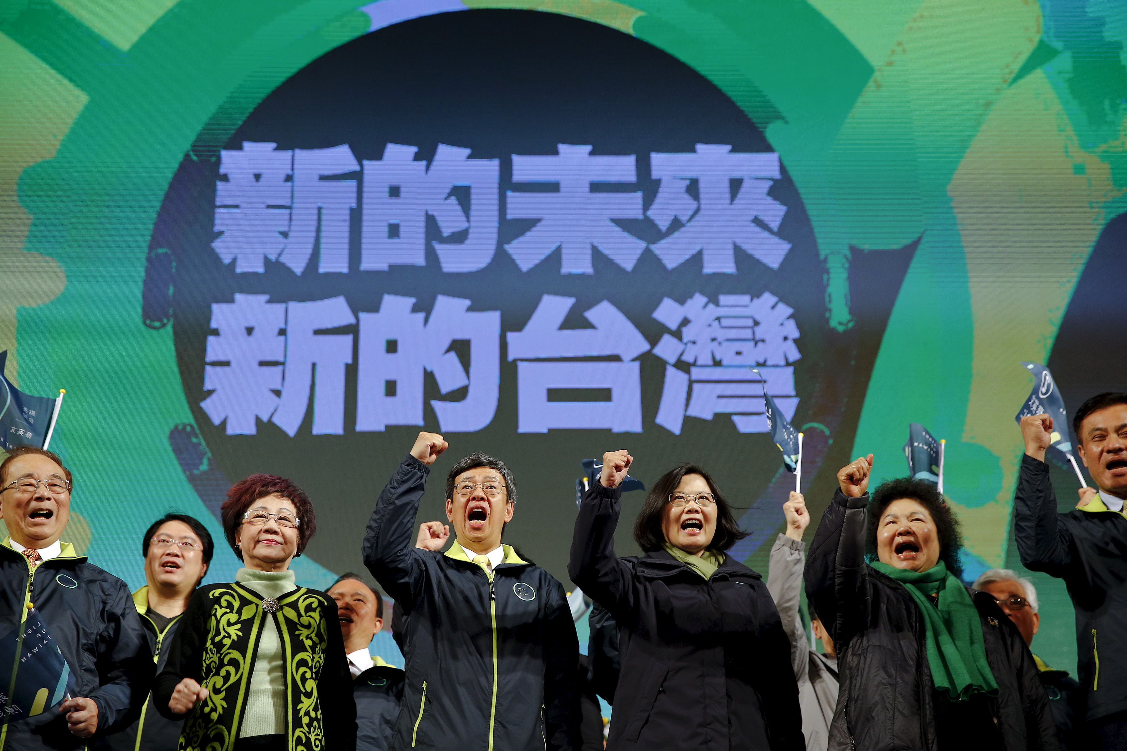 Democratic Progressive Party chairperson and presidential candidate Tsai Ing-wen, third from right, celebrates her election victory with other party members at the DPP's headquarters in Taipei on Jan. 16, 2016 (Damir Sagolj—Reuters)