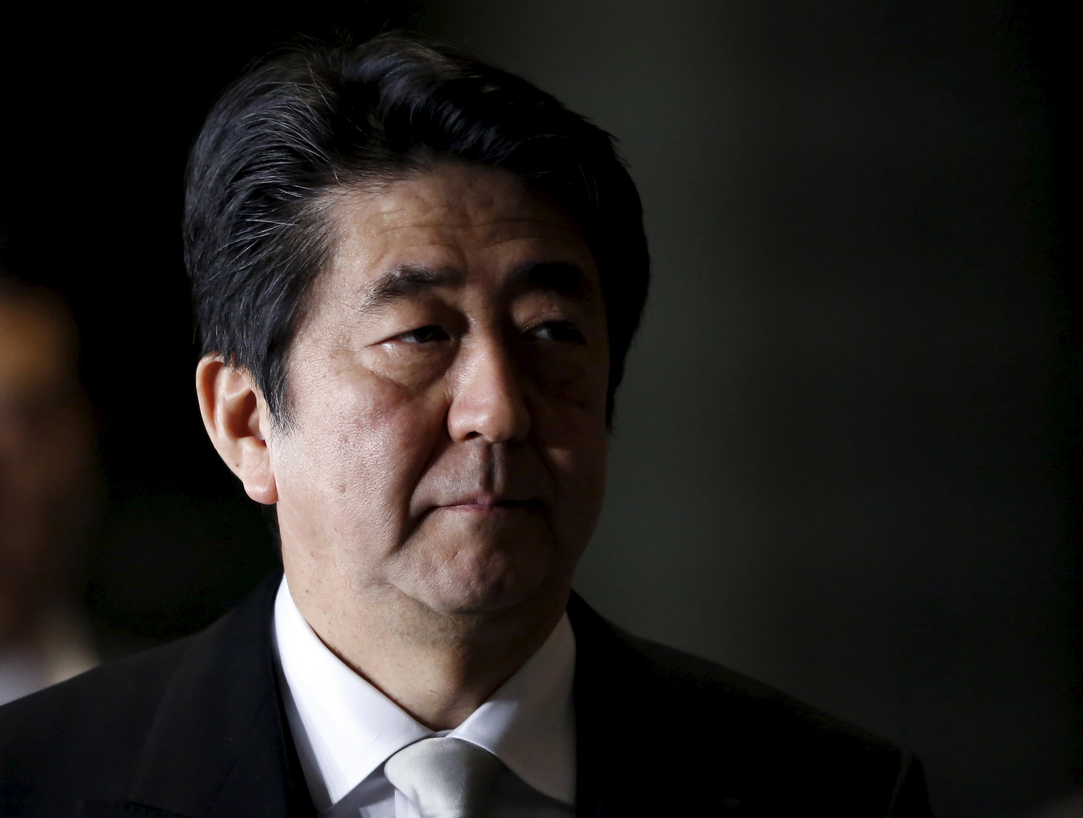 Japan's Prime Minister Abe walks into Abe's official residence in Tokyo