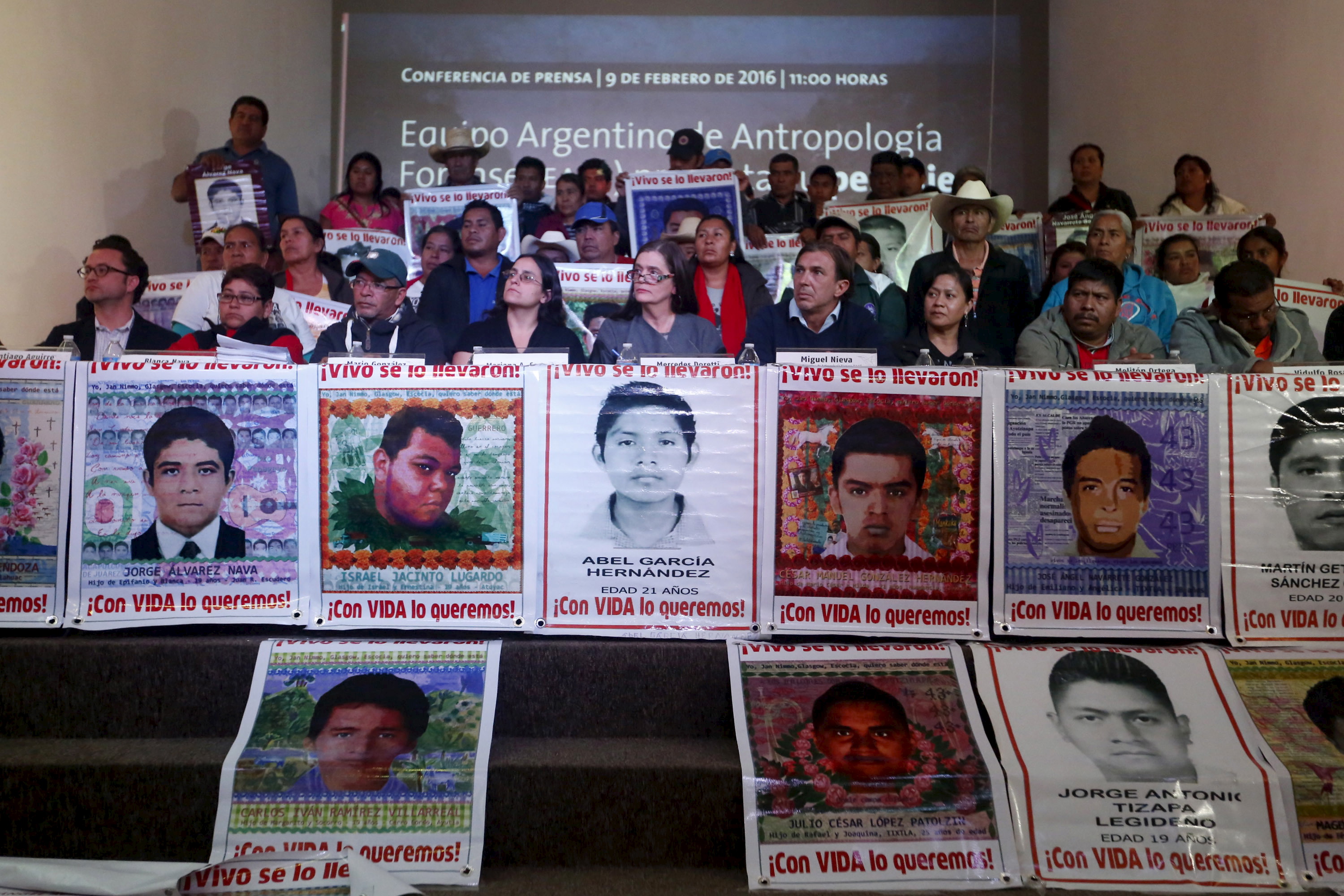 Members of the Argentine Team of Forensic Anthropology, relatives of the 43 students missing from Ayotzinapa College Raul Isidro Burgos and representatives of human rights organizations take part in a news conference in Mexico City