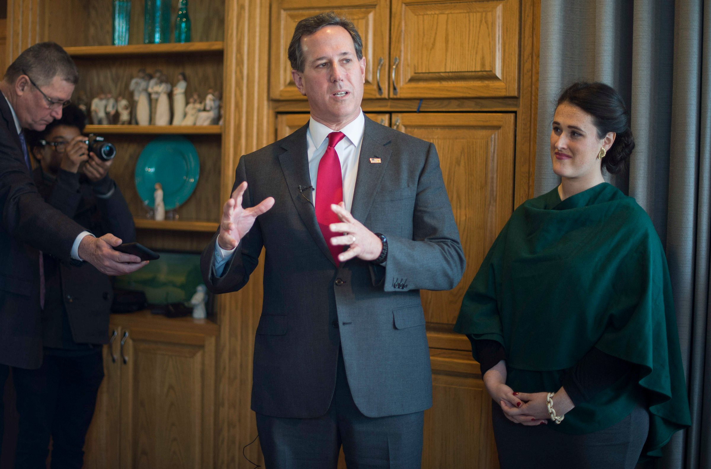 Republican presidential candidate Rick Santorum speaks beside daughter Elizabeth during a campaign stop at a private residence in West Des Moines, Iowa, on Jan. 31, 2016, ahead of the Iowa Caucus.