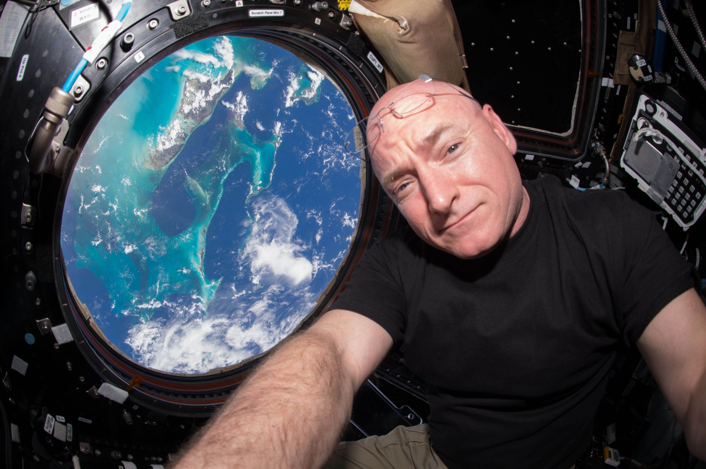 Scott Kelly poses for a selfie photo in the "Cupola" of the International Space Station.