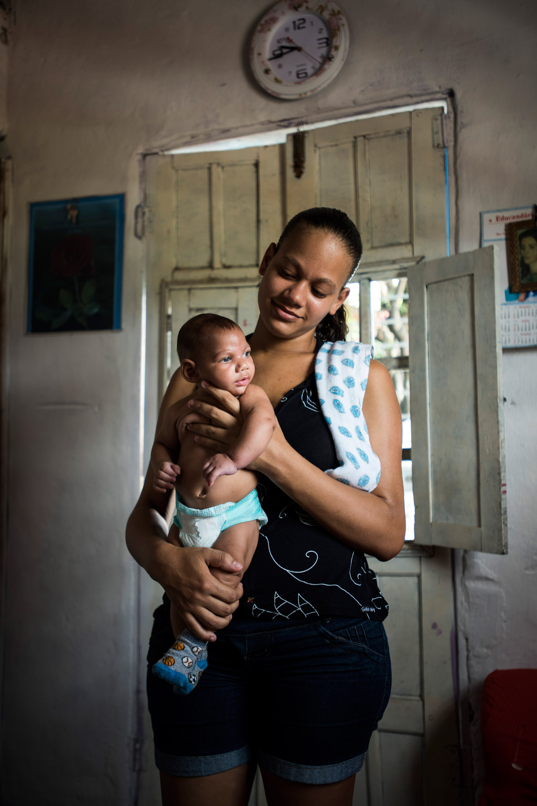 Juliana Diniz da Slva, 22, with her three-month-old son, Pedro Henrique da Silva, in her house in Nova Descoberta, a favela in the outskirts of Recife, Brazil, Feb. 2, 2016. When she was seven months pregnant, doctors discovered the baby had the rare birth defect.