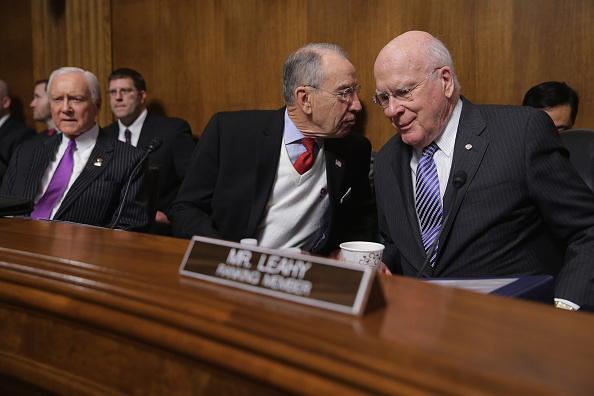 Senate Judiciary Committee Chairman Chuck Grassley (R-IA) (C) speaks with ranking member Sen. Patrick Leahy (D-VT) before a hearing about he impact of heroin and prescription drug abuse in the Dirksen Senate Office Building on Capitol Hill January 27, 2016 in Washington, DC.