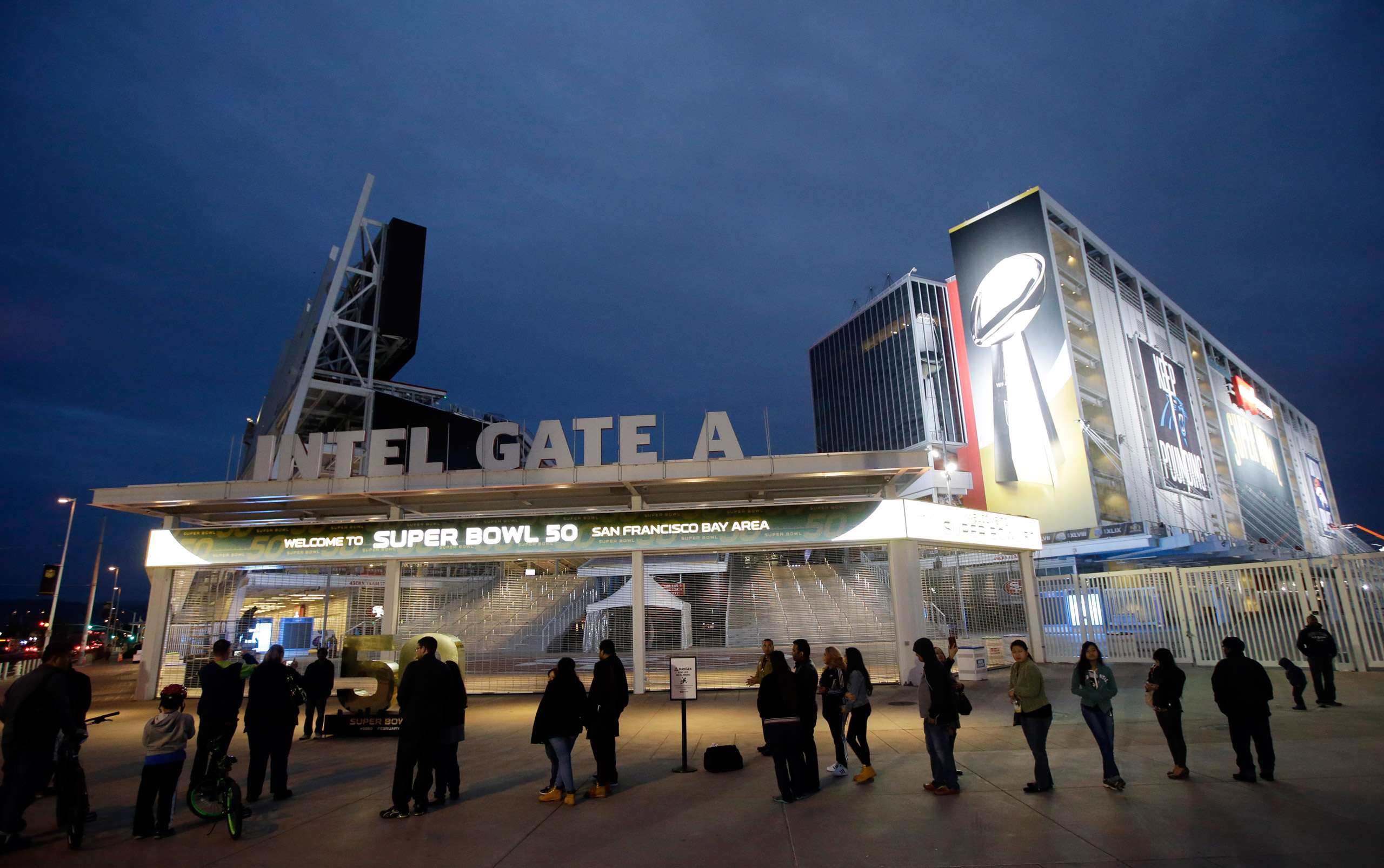 Visitors line up to pose for photos outside of Levi's Stadium Saturday, Jan. 30, 2016, in Santa Clara, Calif. Super Bowl 50, between the Carolina Panthers and Denver Broncos, will be played at Levi's Stadium Feb. 7.  (AP Photo/Marcio Jose Sanchez)