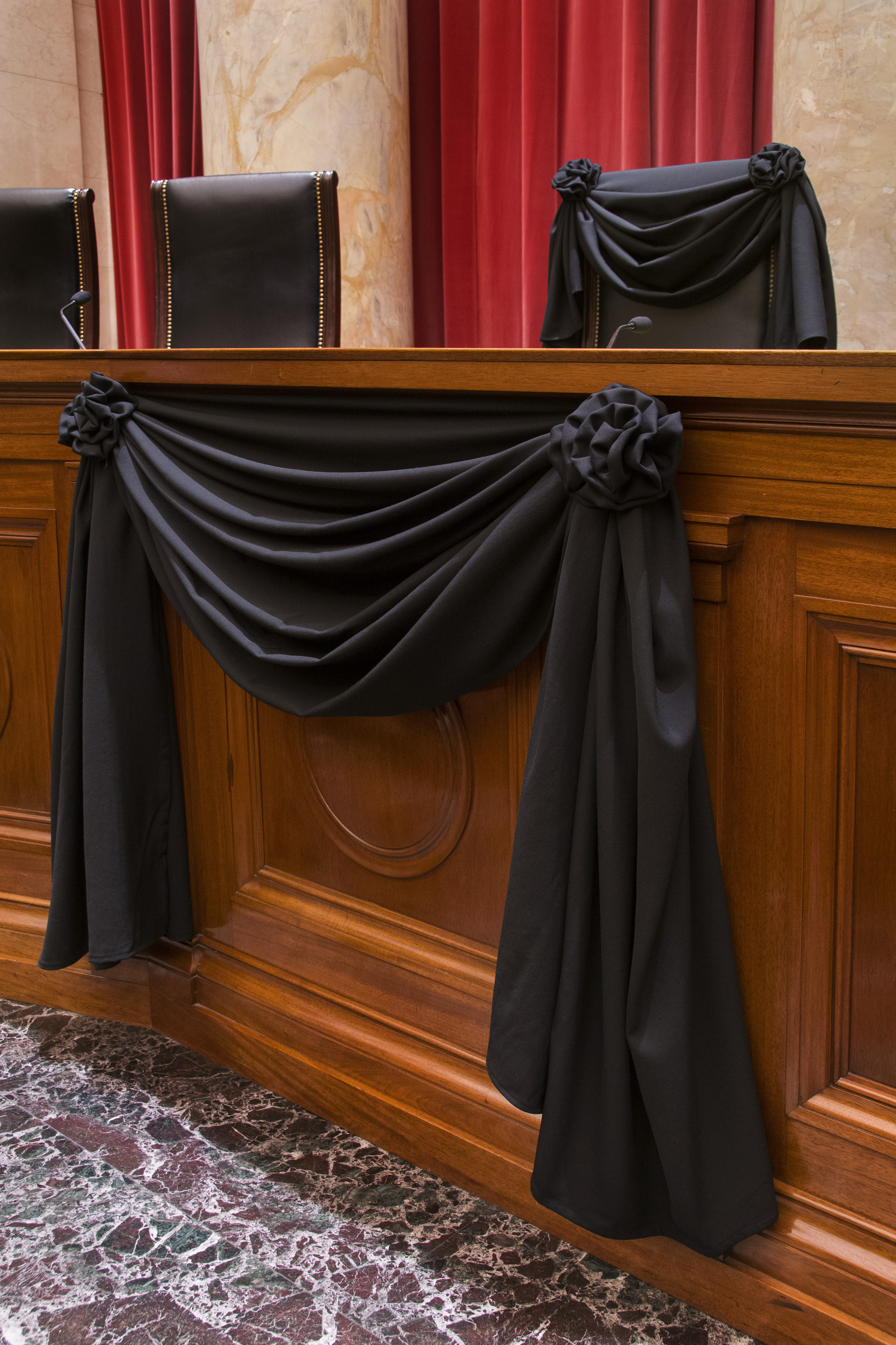 Associate Justice Antonin Scalia’s bench chair and the bench in front of his seat are draped in black in the Courtroom of the Supreme Court following his Feb. 13, 2016 death.