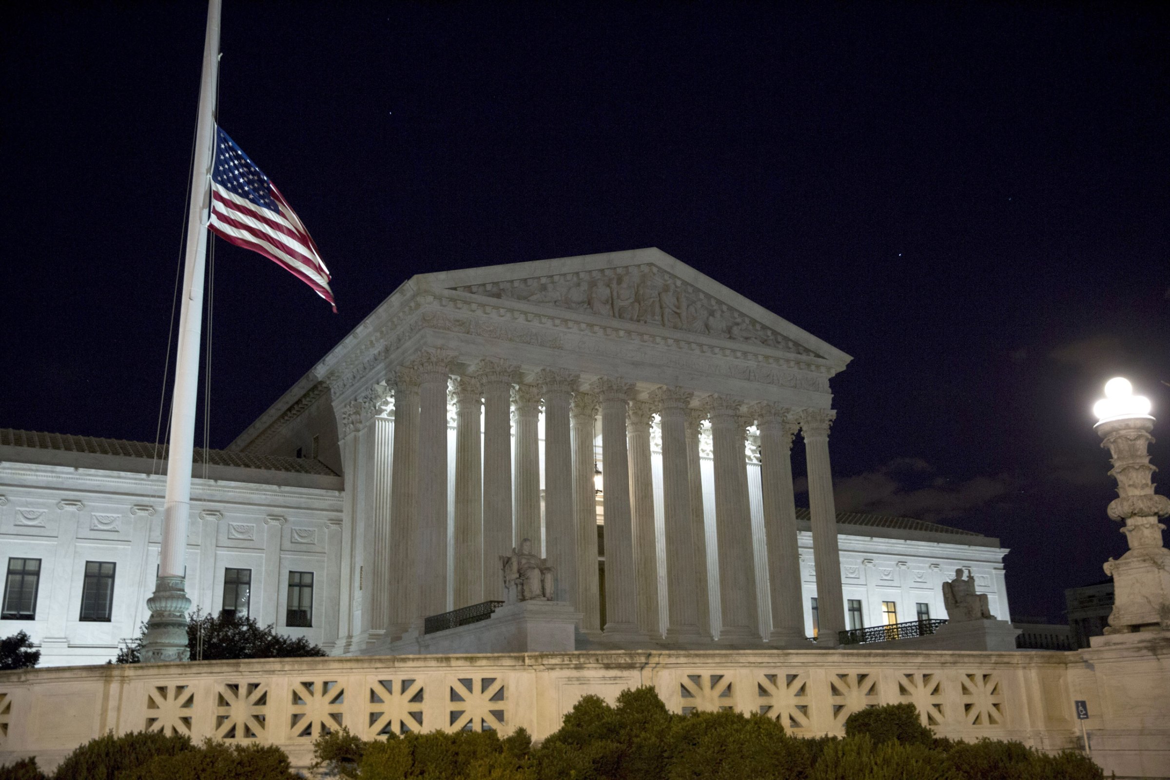 WASHINGTON, DC - FEBRUARY 13: The American flag flies at half mast at the U.S. Supreme Court February 13, 2016 in Washington, DC. Supreme Court Justice Antonin Scalia was at a Texas Ranch Saturday morning when he died at the age of 79. (Photo by Drew Angerer/Getty Images)