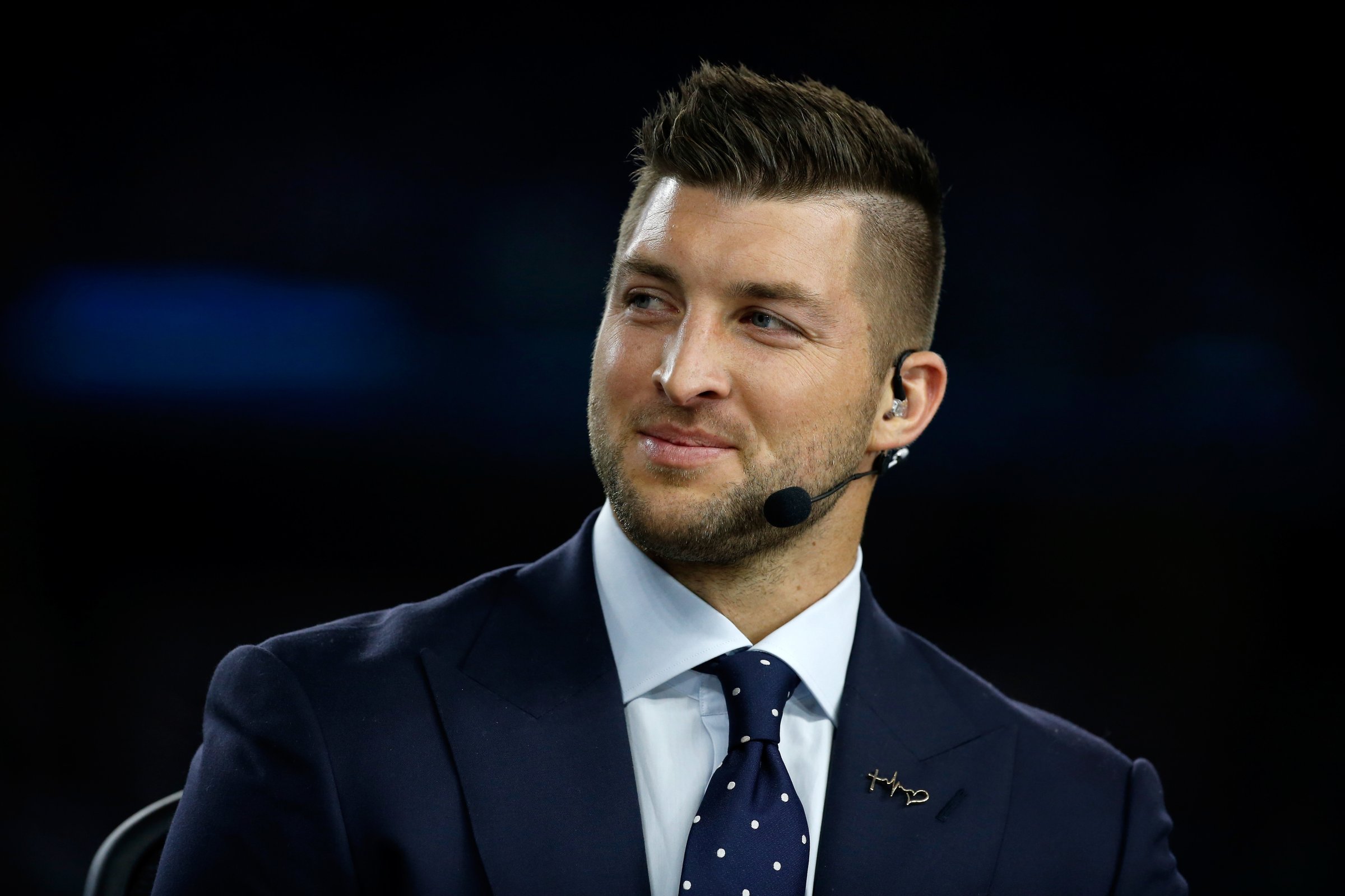 Broadcaster Tim Tebow of the SEC Network speaks on air before the Goodyear Cotton Bowl at AT&amp;T Stadium on Dec. 31, 2015 in Arlington, Texas.