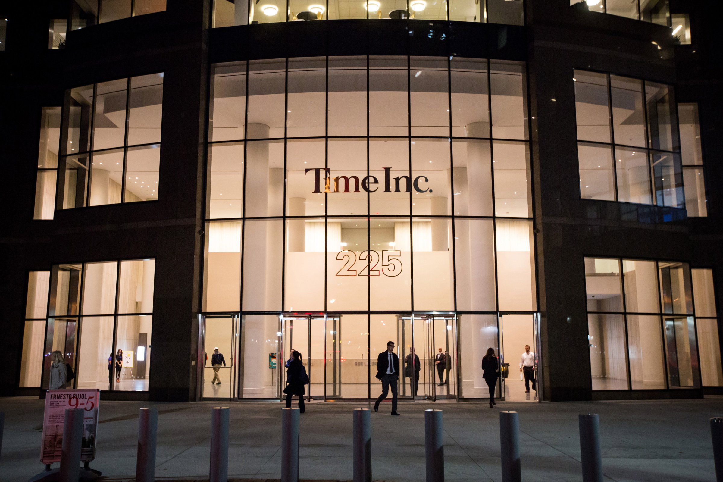Pedestrians walk past the new headquarters of Time Inc. in New York, N.Y, on Tuesday, Oct. 27, 2015.