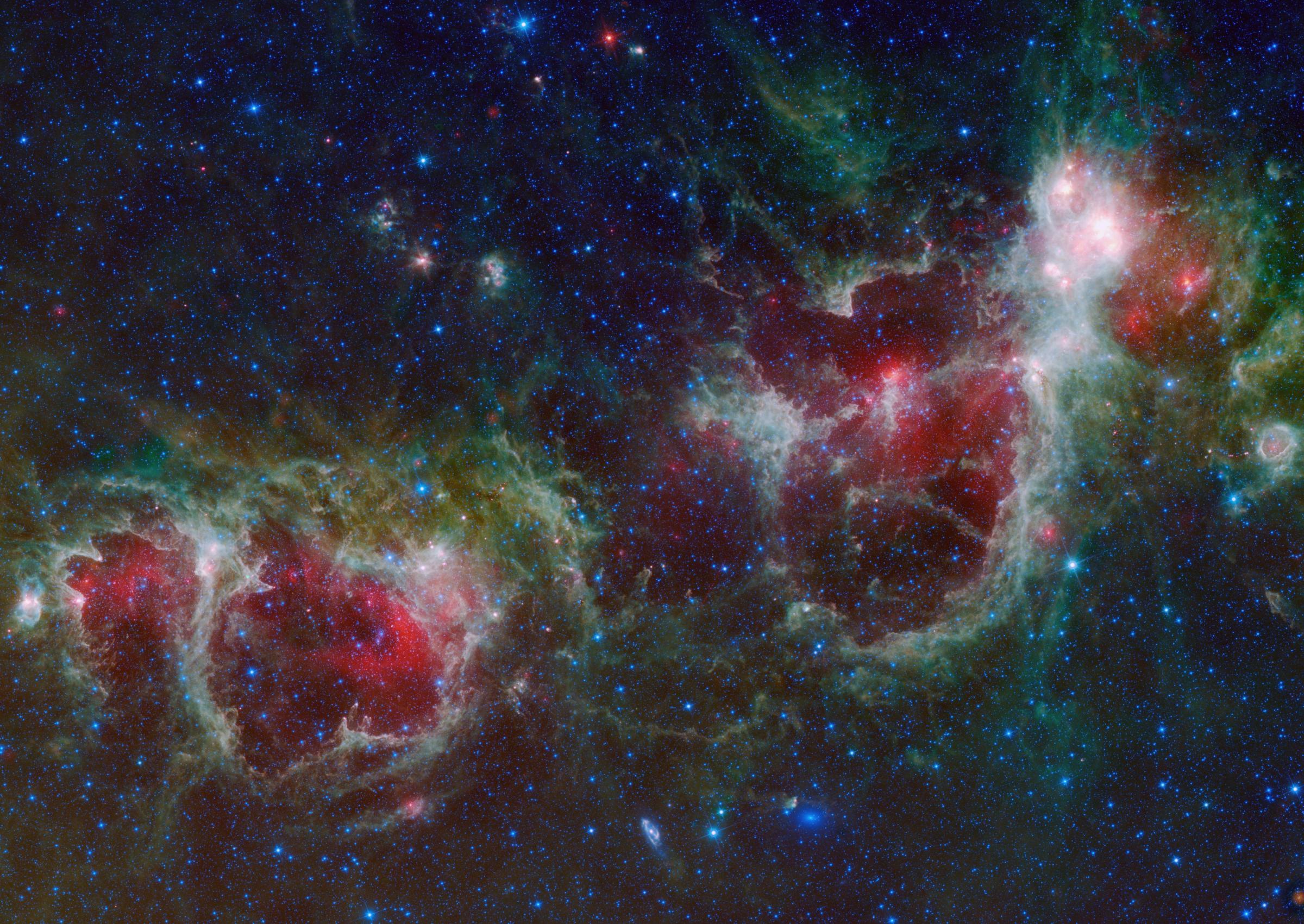 The Heart and Soul nebulae are seen in this infrared mosaic from NASA's WISE. Located in the constellation Cassiopeia, about 6,000 light-years from Earth, the Heart and Soul nebulae form a vast star-forming complex that makes up part of the Perseus spiral arm of our Milky Way galaxy. The nebula to the right is the Heart, and to the left is the Soul nebula.
