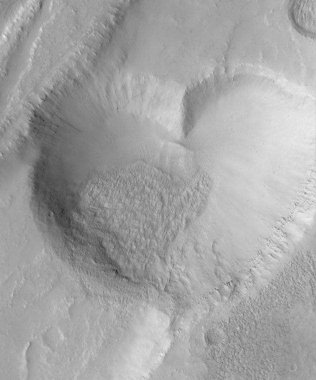 Scientists discovered a valentine from Mars when a camera on the Mars Global Surveyor shot a heart-shaped pit, formed when a straight-walled trough collapsed. The photo was taken by the Mars Orbiter Camera on the Mars Global Surveyor and released in June 1999.