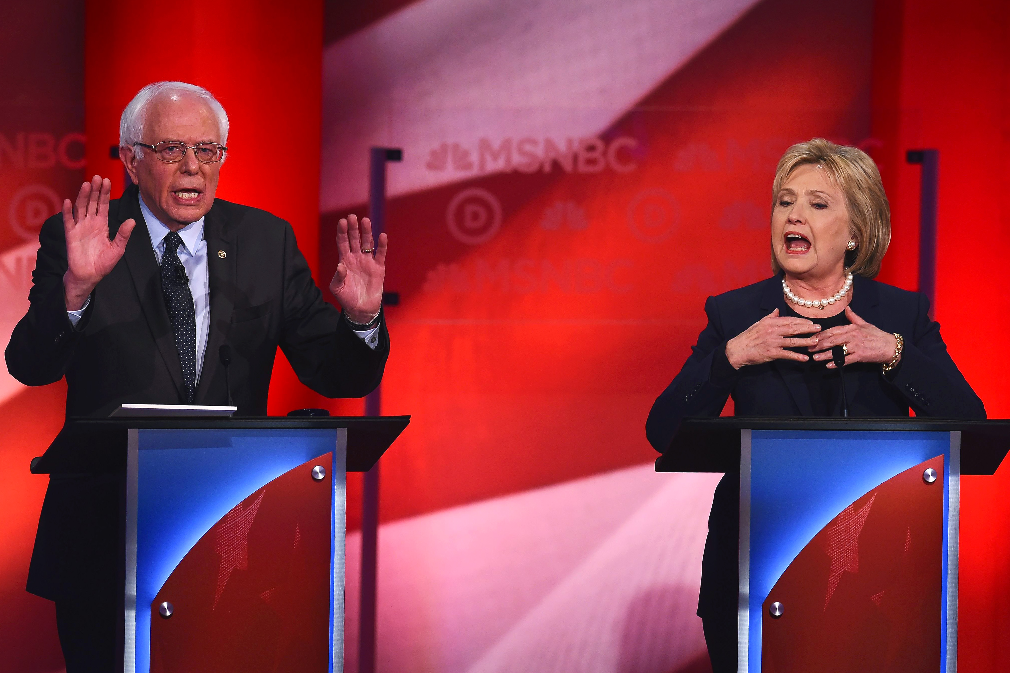 Democratic presidential candidates former Secretary of State Hillary Clinton and U.S. Sen. Bernie Sanders (I-VT) appear at a Democratic debate at the University of New Hampshire on Feb. 4, 2016 in Durham, N.H. (Jewel Samad—AFP/Getty Images)