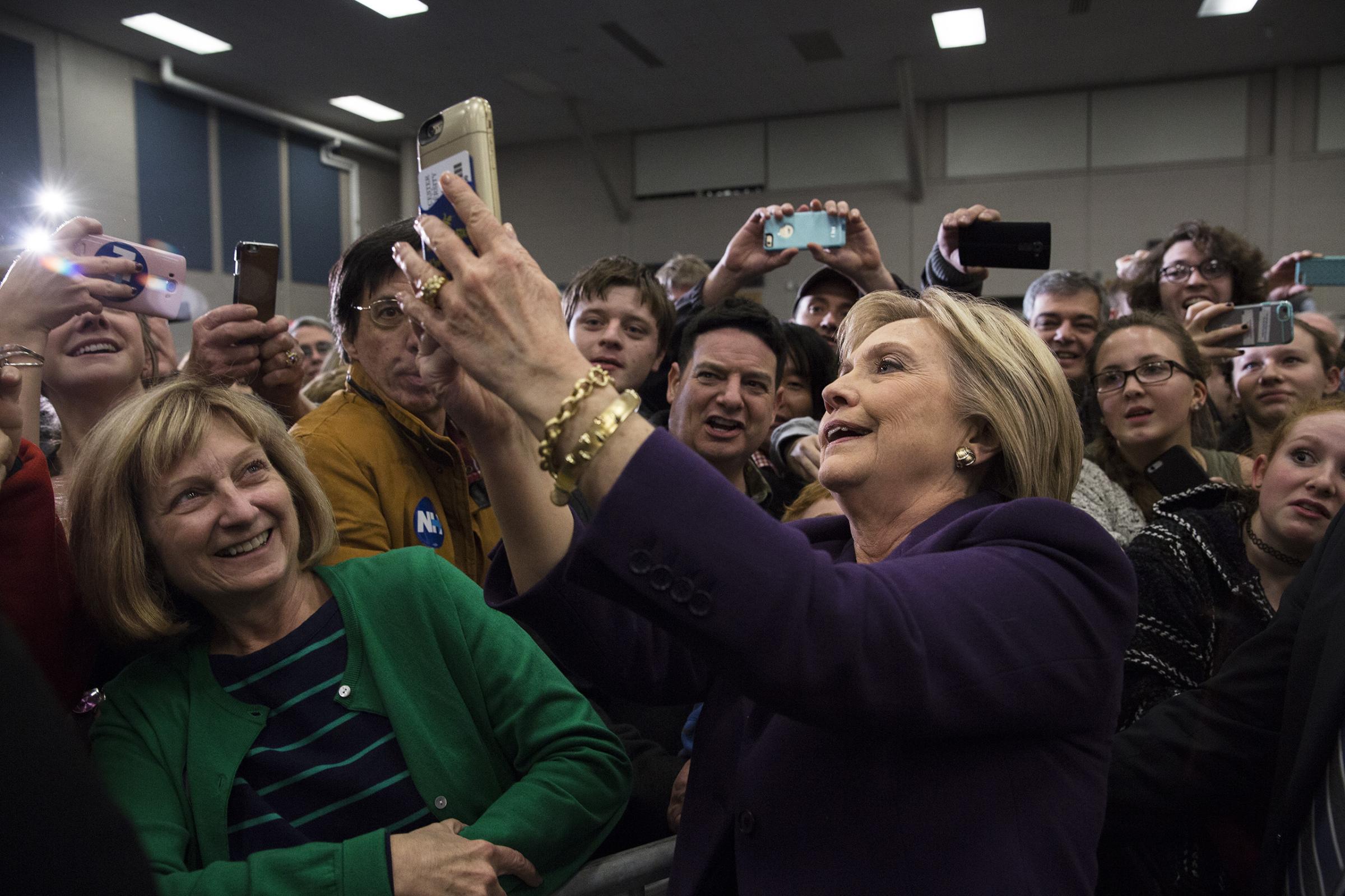 February 2, 2016 - Hampton, New Hampshire, United States: Democratic Presidential candidate, Hillary Clinton engaging in selfies while campaigning with Gabby Giffords and Mark Kelly at Winnacunnet High School. Photograph by James Nachtwey for TIME